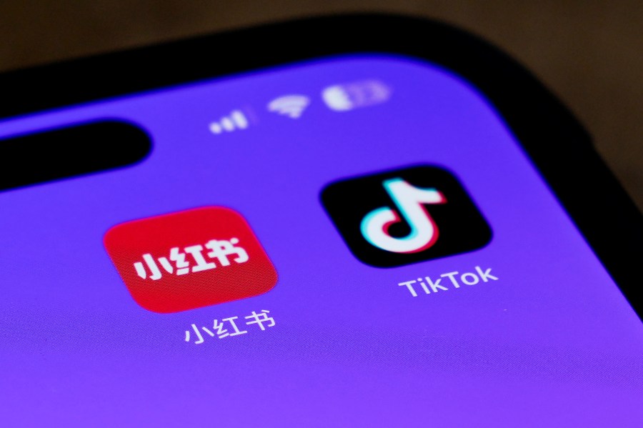 Icons for the smartphone apps Xiaohongshu and TikTok are seen on a smartphone screen in Beijing, Tuesday, Jan. 14, 2025. (AP Photo/Andy Wong)