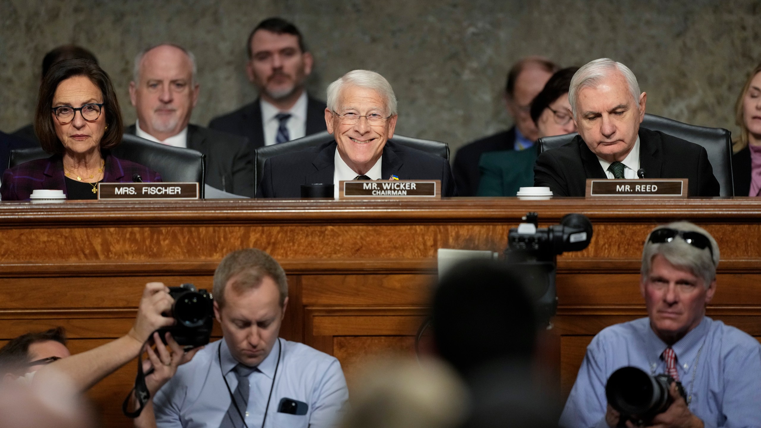 Sen. Deb Fischer, R-Neb., left, Committee chairman Sen. Roger Wicker, R-Miss., center, and Sen. Jack Reed, D-R.I., the ranking member, right, during the Senate Armed Services Committee confirmation hearing for Pete Hegseth, President-elect Donald Trump's choice to be Defense secretary, at the Capitol in Washington, Tuesday, Jan. 14, 2025. (AP Photo/Ben Curtis)