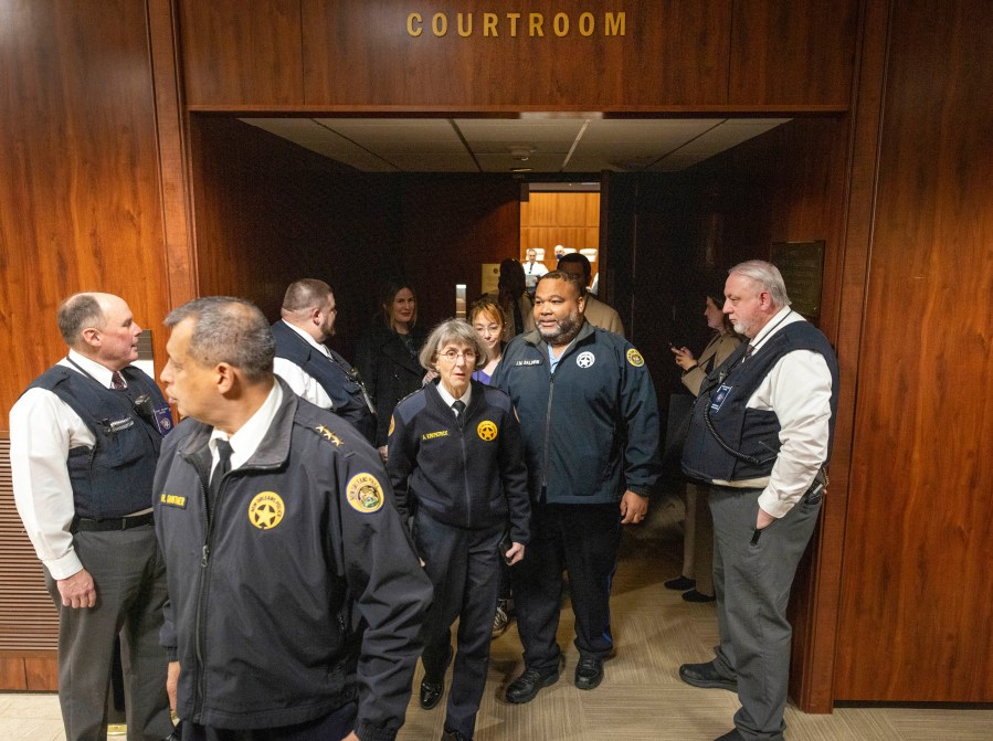 New Orleans Police Superintendent Anne Kirkpatrick, center, along with her NOPD district chiefs, walks out of Federal Court, Tuesday, Jan. 14, 2025, in New Orleans, after a judge ruled the New Orleans Police Department can begin the process of ending longstanding federal oversight. (Chris Granger/The Times-Picayune/The New Orleans Advocate via AP)