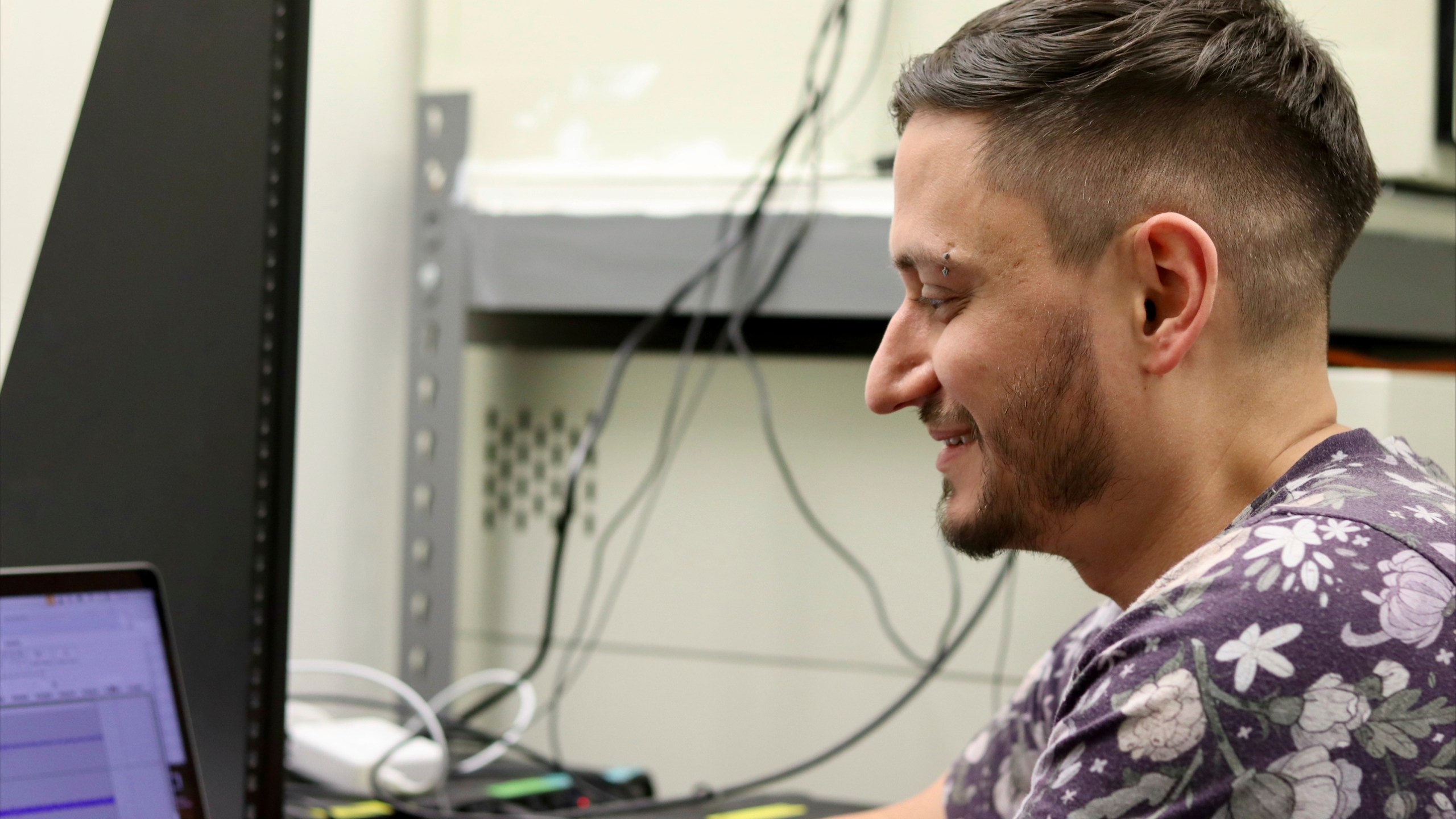 McGill University postdoctoral fellow Logan James, an affiliated researcher with the nonprofit Earth Species Project, examines zebra finch recordings on Thursday, Dec. 12, 2024 in Montreal, Canada. (AP Photo/James Pollard)