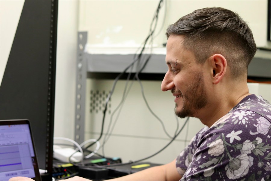 McGill University postdoctoral fellow Logan James, an affiliated researcher with the nonprofit Earth Species Project, examines zebra finch recordings on Thursday, Dec. 12, 2024 in Montreal, Canada. (AP Photo/James Pollard)