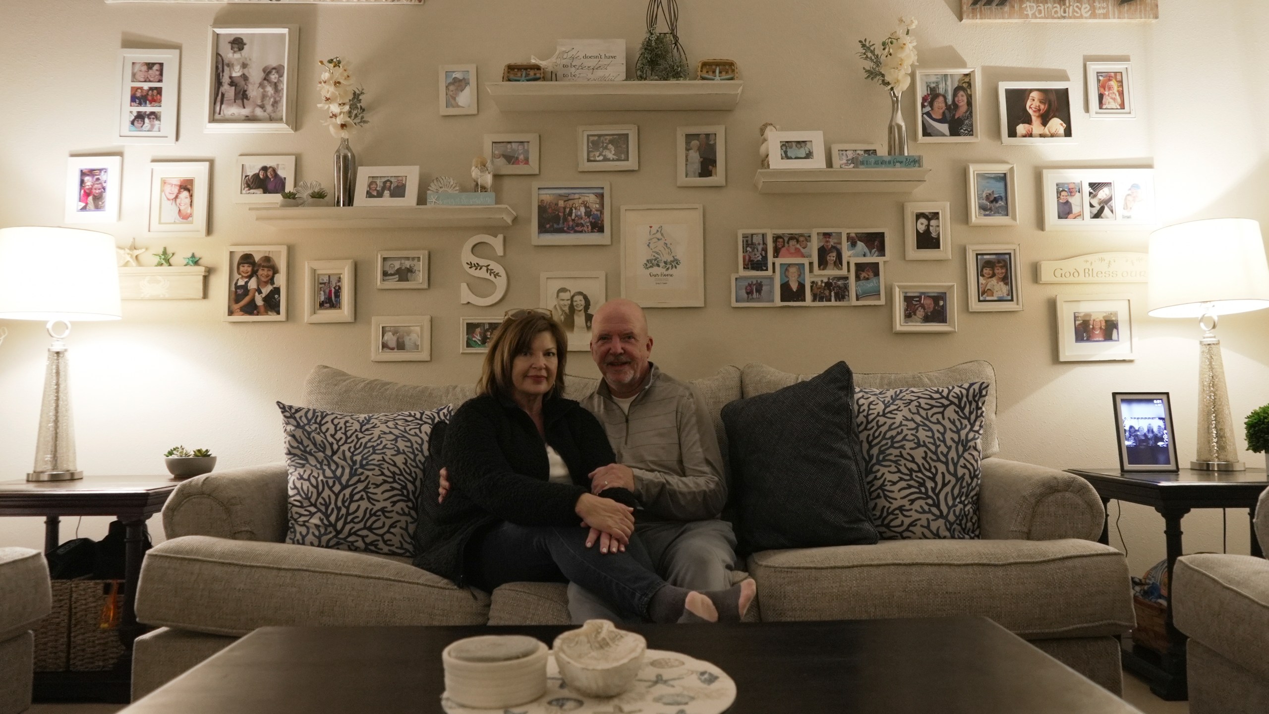 Susan and Greg Scarbro sit for a portrait in their home in Sunset Beach, N.C. on Jan. 3, 2025. (AP Photo/Laura Bargfeld)