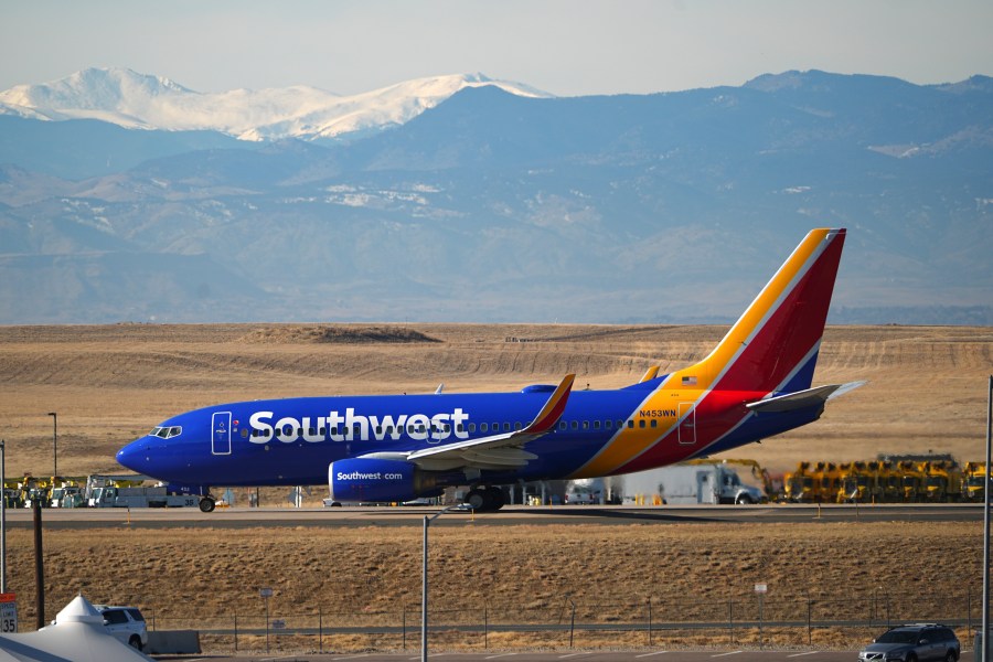 Southwest Airlines jetliner taxis down a runway for take off at Denver International Airport, Tuesday, Dec. 24, 2024, in Denver. (AP Photo/David Zalubowski)