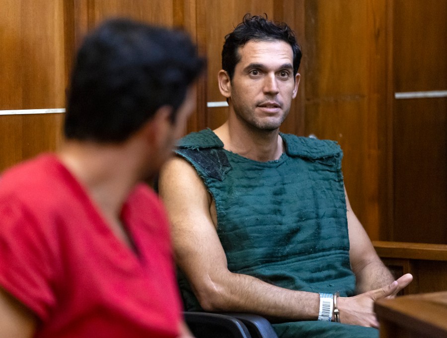 FILE - Alon Alexander, 37, right, and his twin brother, Oren, left, attend their bond hearing at the Richard E. Gerstein Justice Building after being charged with multiple state and federal crimes, including sex trafficking and rape, on Friday, Dec. 13, 2024, in Miami. (Matias J. Ocner/Miami Herald via AP, Pool)