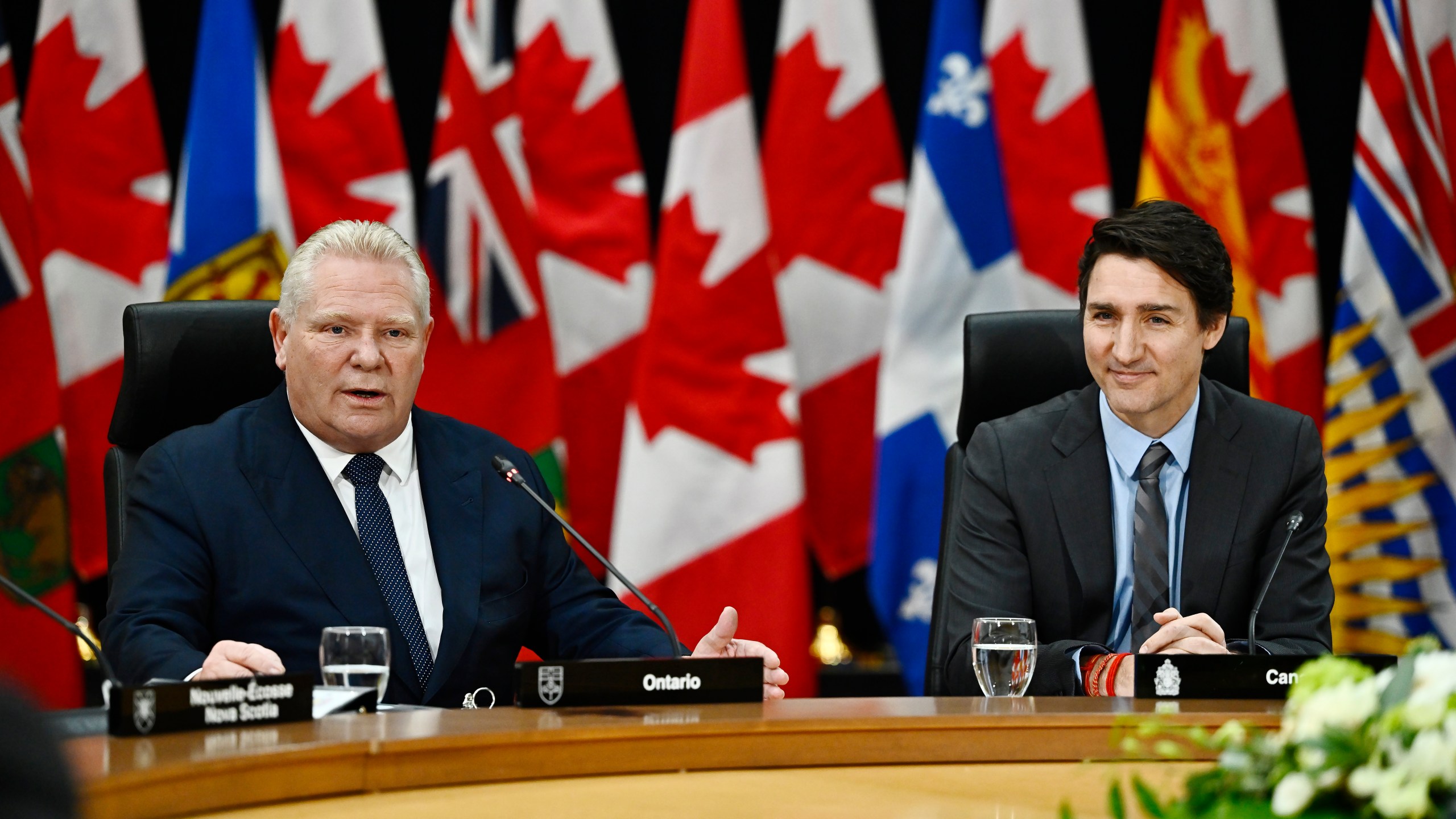 Ontario Premier Doug Ford, left, speaks, as Prime Minister Justin Trudeau looks on during a first ministers meeting in Ottawa on Wednesday, Jan. 15, 2025. (Justin Tang/The Canadian Press via AP)