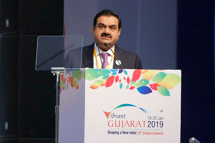 FILE- Adani group Chairman Gautam Adani speaks during the inauguration of the 9th Vibrant Gujarat Global Summit in Gandhinagar, India, Jan. 18, 2019. (AP Photo/Ajit Solanki, File)