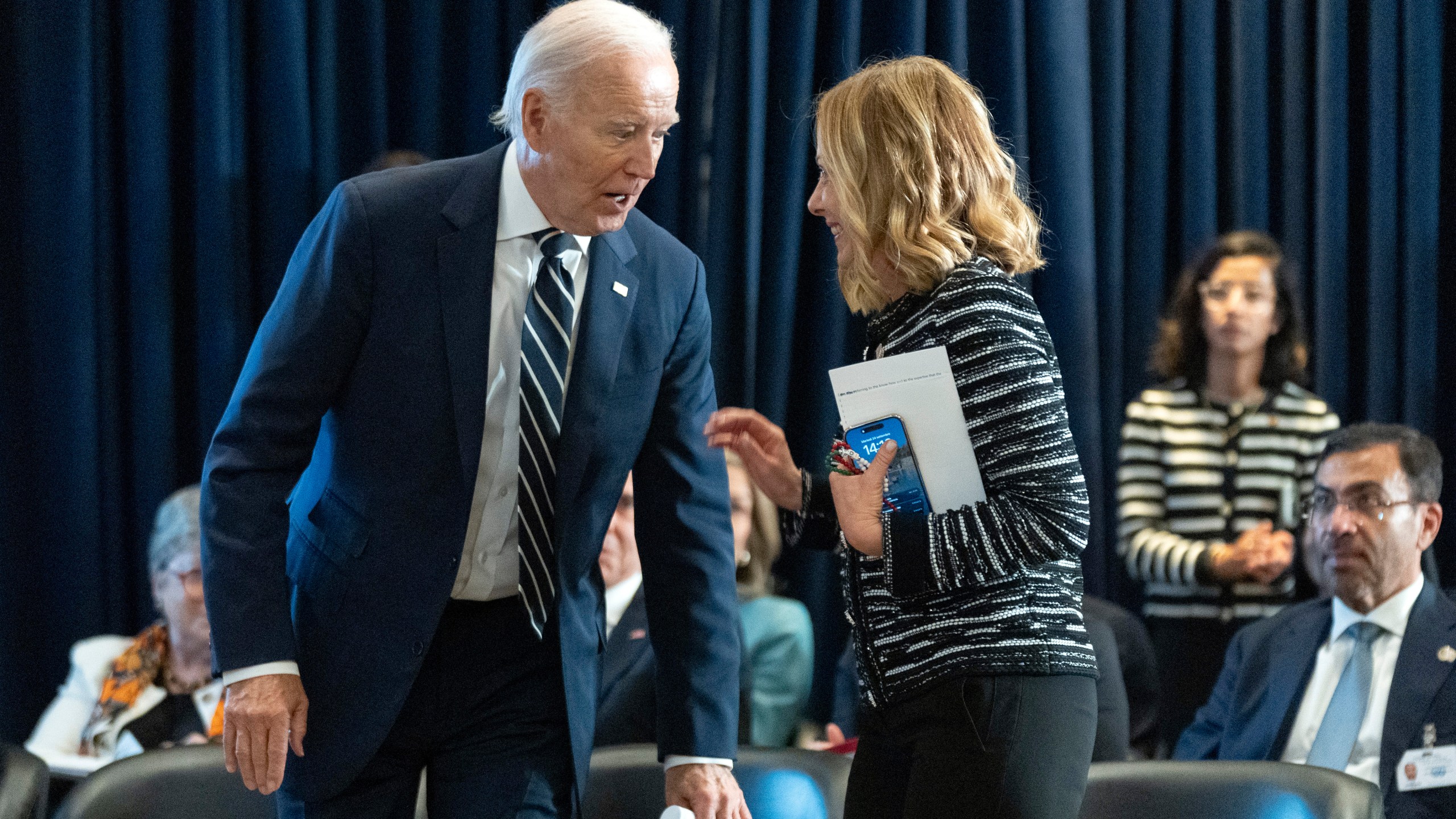 FILE - U.S. President Joe Biden talks to Italy's Prime Minister Giorgia Meloni at the meeting of the Global Coalition to Address Synthetic Drug Threats in New York, Sept. 24, 2024. (AP Photo/Manuel Balce Ceneta, File)