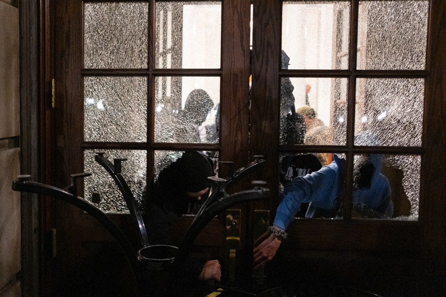 FILE - Students with the Gaza Solidarity Encampment block the entrance of Hamilton Hall at Columbia University after taking over it, April 30, 2024 in New York. (Marco Postigo Storel via AP, File)