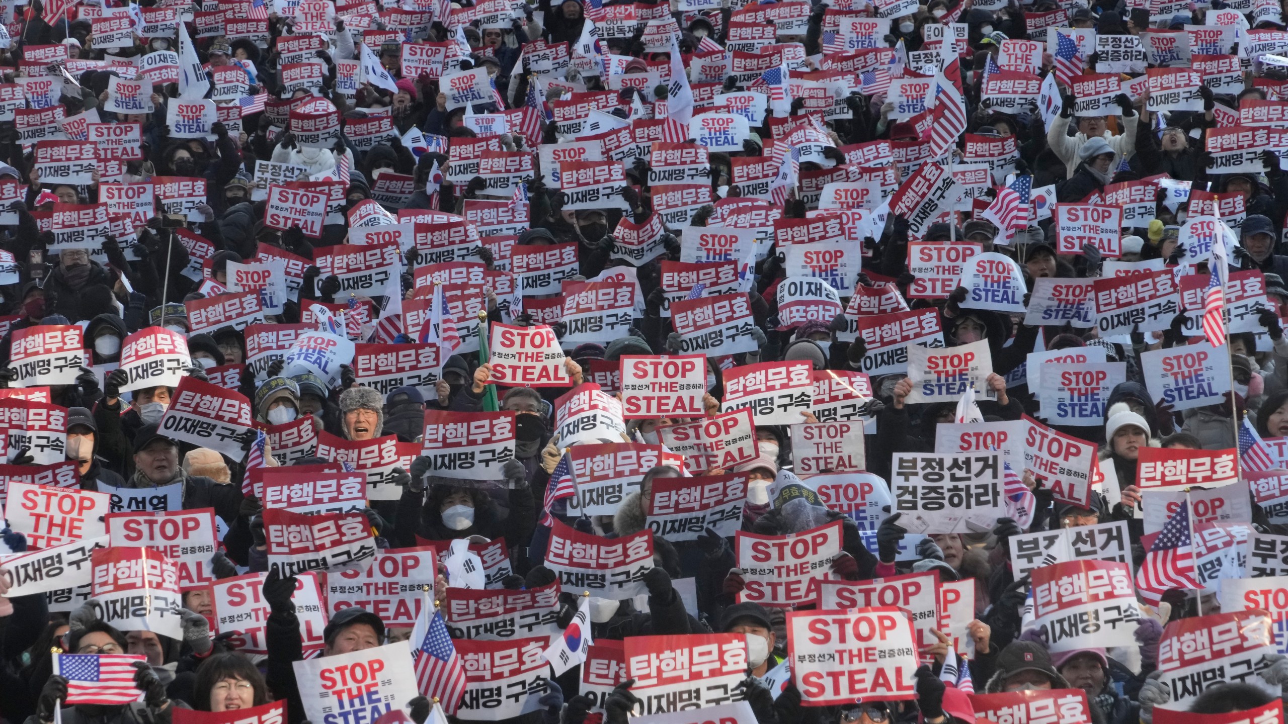 FILE- Supporters of impeached South Korean President Yoon Suk Yeol stage a rally to oppose his impeachment in Seoul, South Korea, Saturday, Jan. 11, 2025. The letters read, "Impeachment is invalid." (AP Photo/Ahn Young-joon, File)