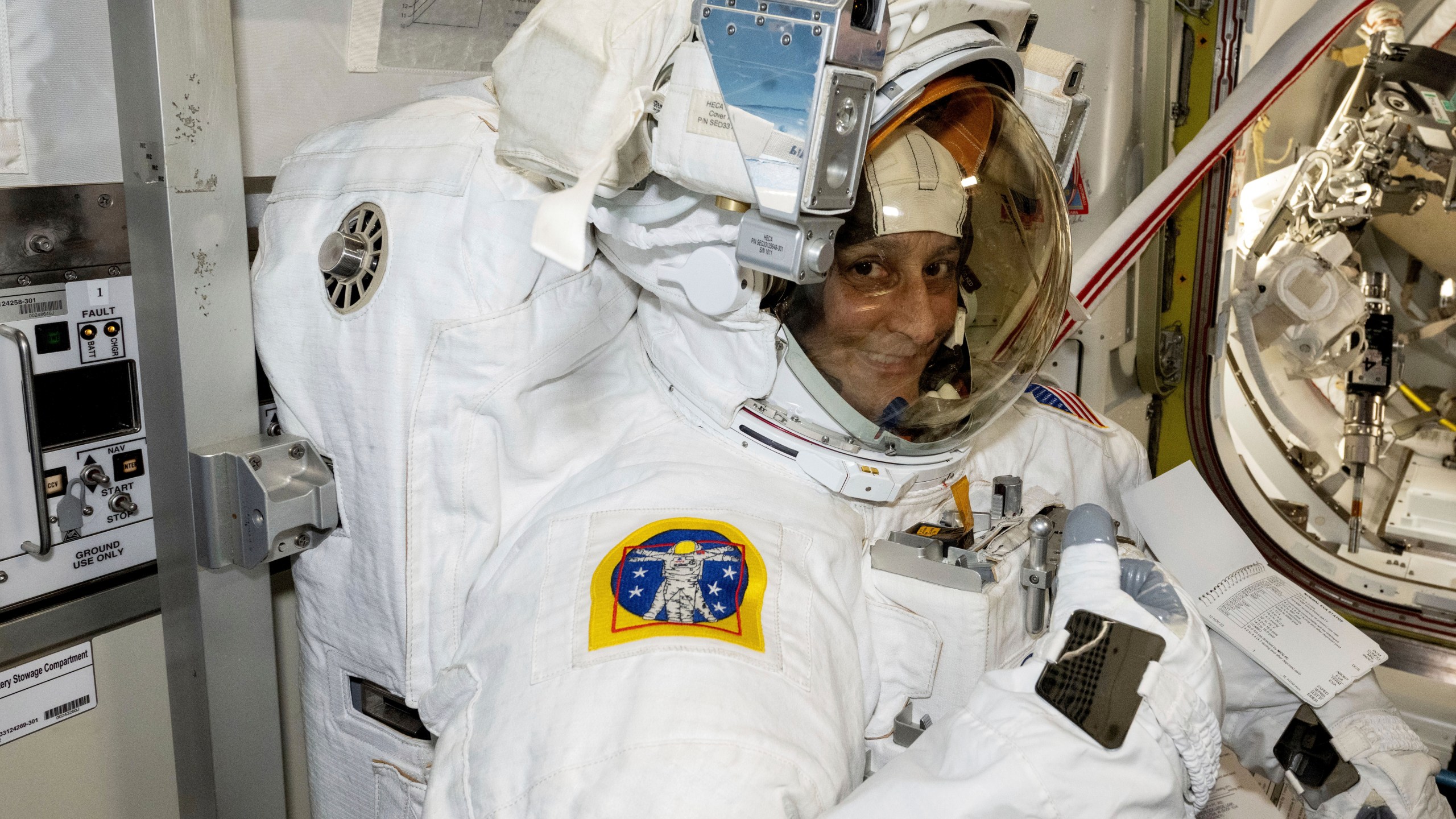 In this photo provided by NASA, astronaut Suni Williams tries on and evaluates her spacesuit aboard the International Space Station on Jan. 9, 2025. (NASA via AP)