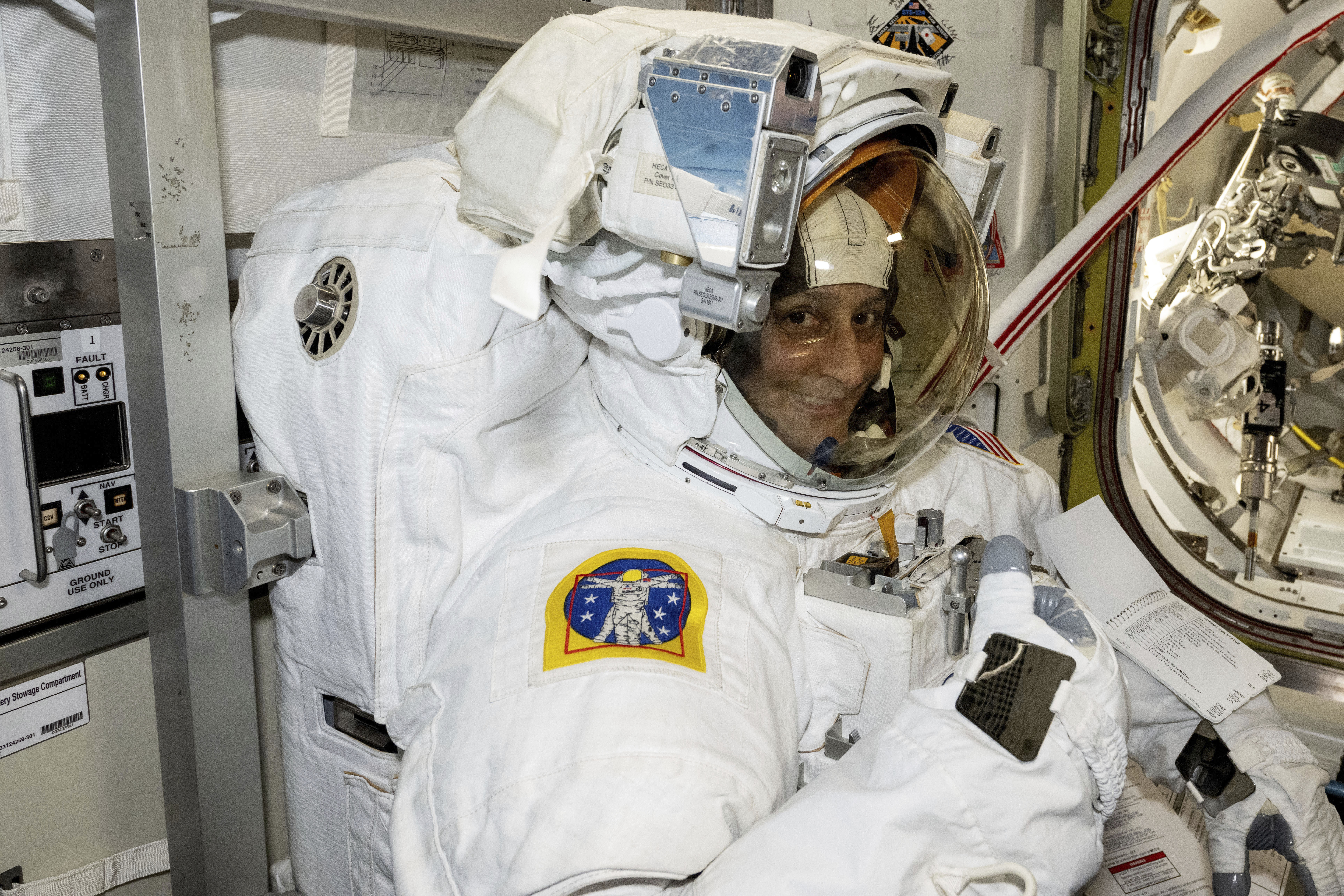 In this photo provided by NASA, astronaut Suni Williams tries on and evaluates her spacesuit aboard the International Space Station on Jan. 9, 2025. (NASA via AP)