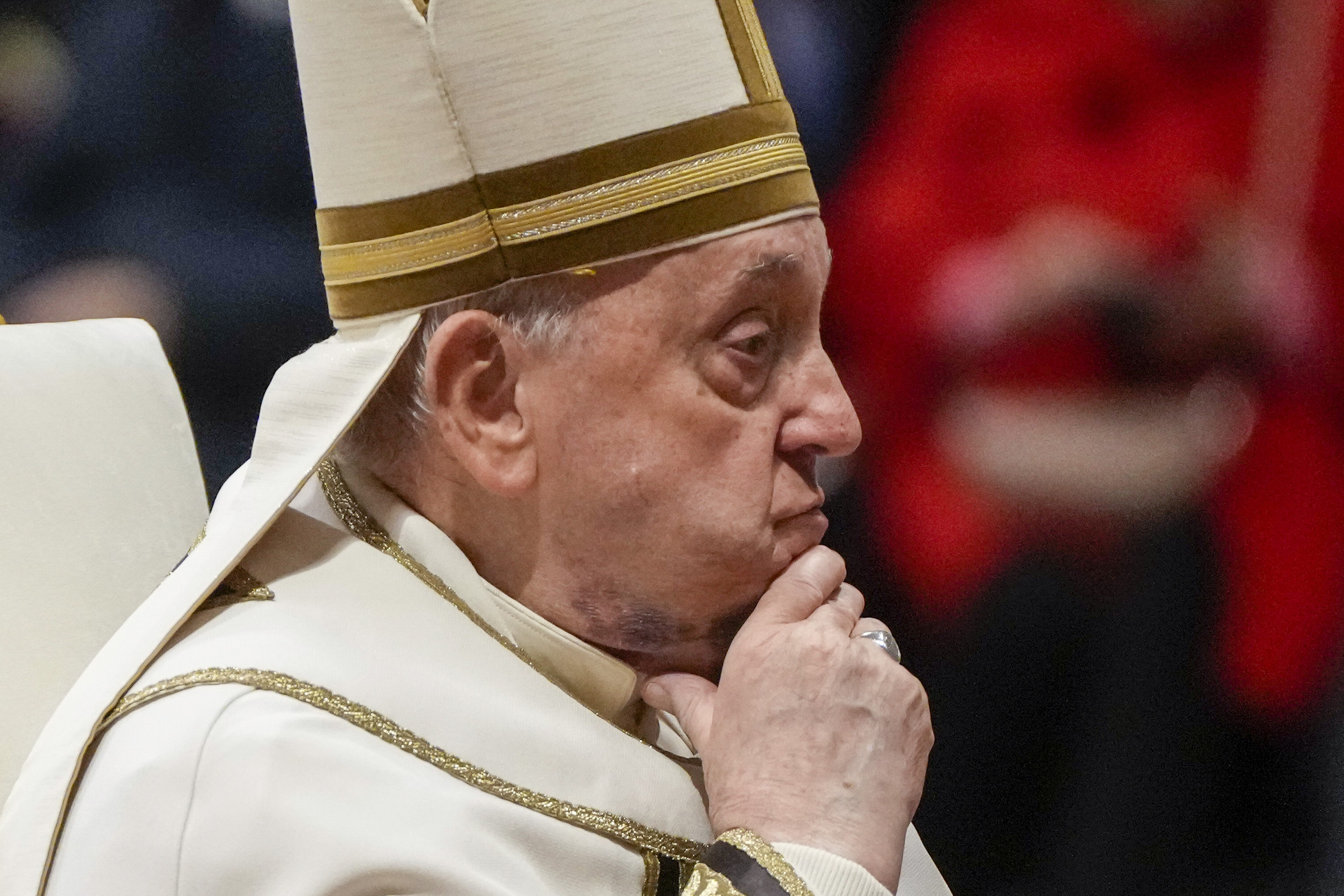 FILE - Pope Francis reacts during a solemn mass where he made 21 new cardinals in St. Peter's Basilica at The Vatican, Saturday, Dec. 7, 2024. (AP Photo/Gregorio Borgia, File)