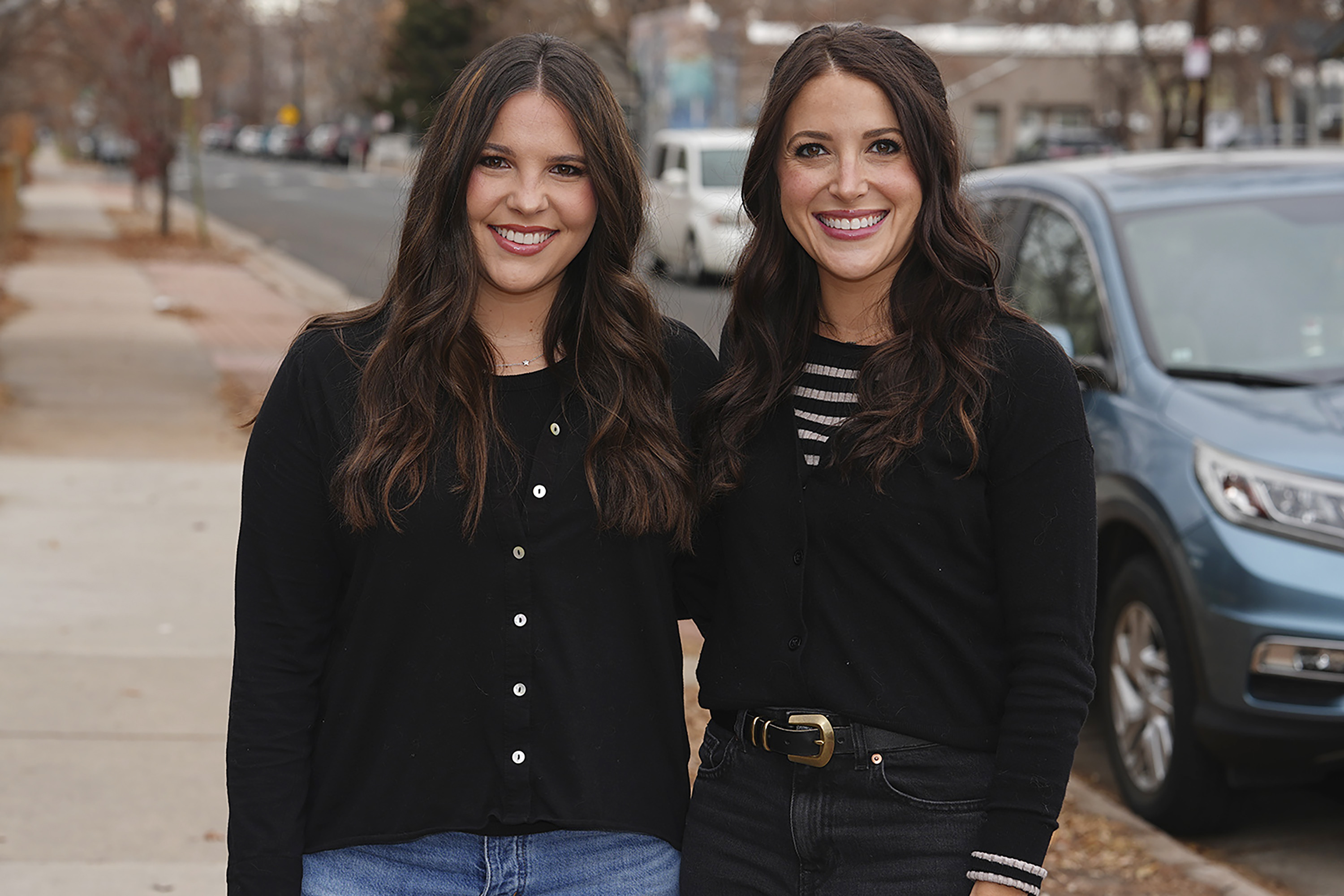 Jacqueline and Alexa Child stand for a portrait in their neighborhood Wednesday, Dec. 18, 2024, in Denver. (AP Photo/David Zalubowski)