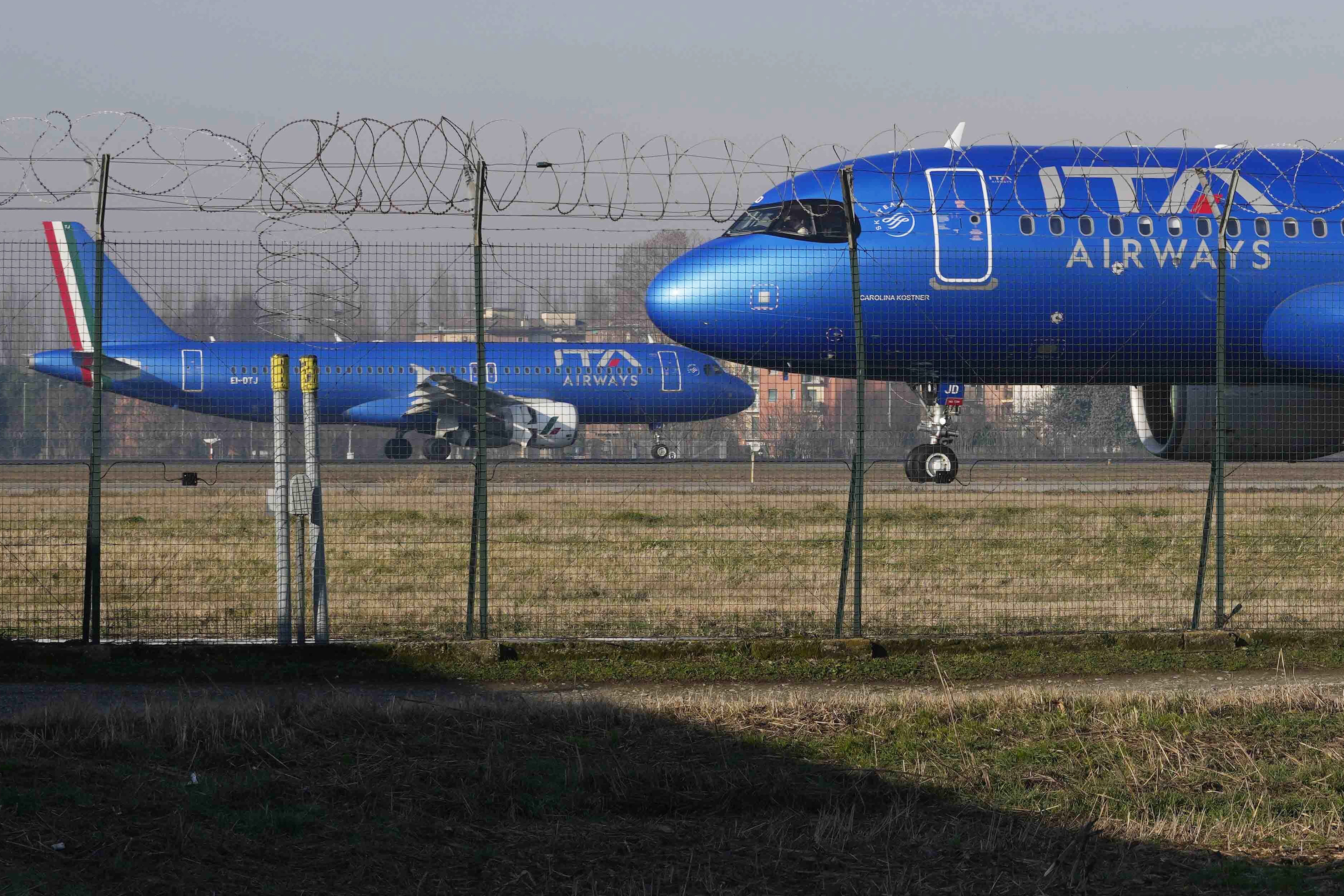 FILE - ITA Airways aircraft stand by on the tarmac before taking off from Linate airport in Milan, Italy, Wednesday, Jan. 24, 2024. (AP Photo/Luca Bruno, File)