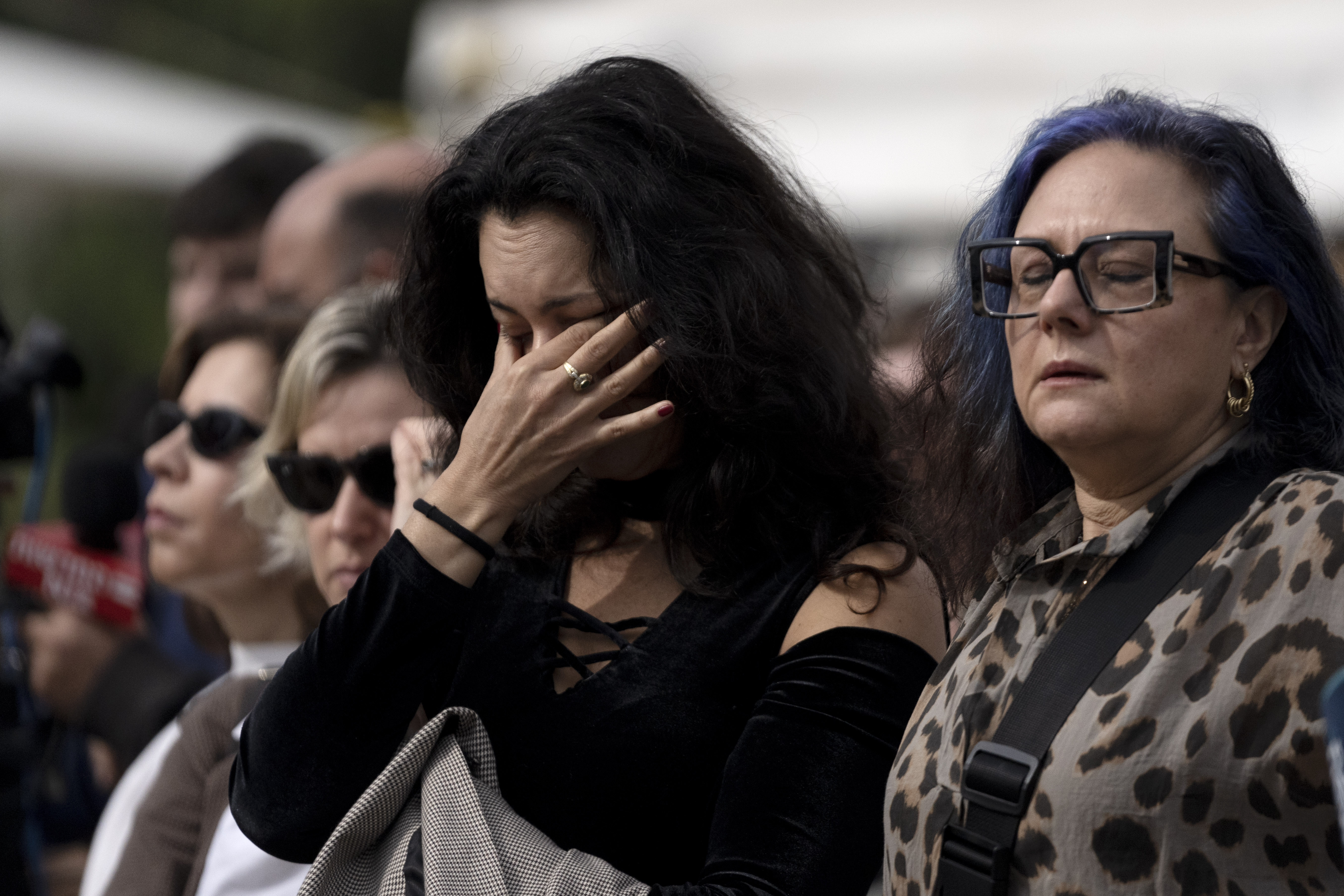 FILE - A woman weeps during a statement by relatives of hostages held in the Gaza Strip, in Tel Aviv, Israel, Friday, Jan. 17, 2025. (AP Photo/Maya Alleruzzo, File)