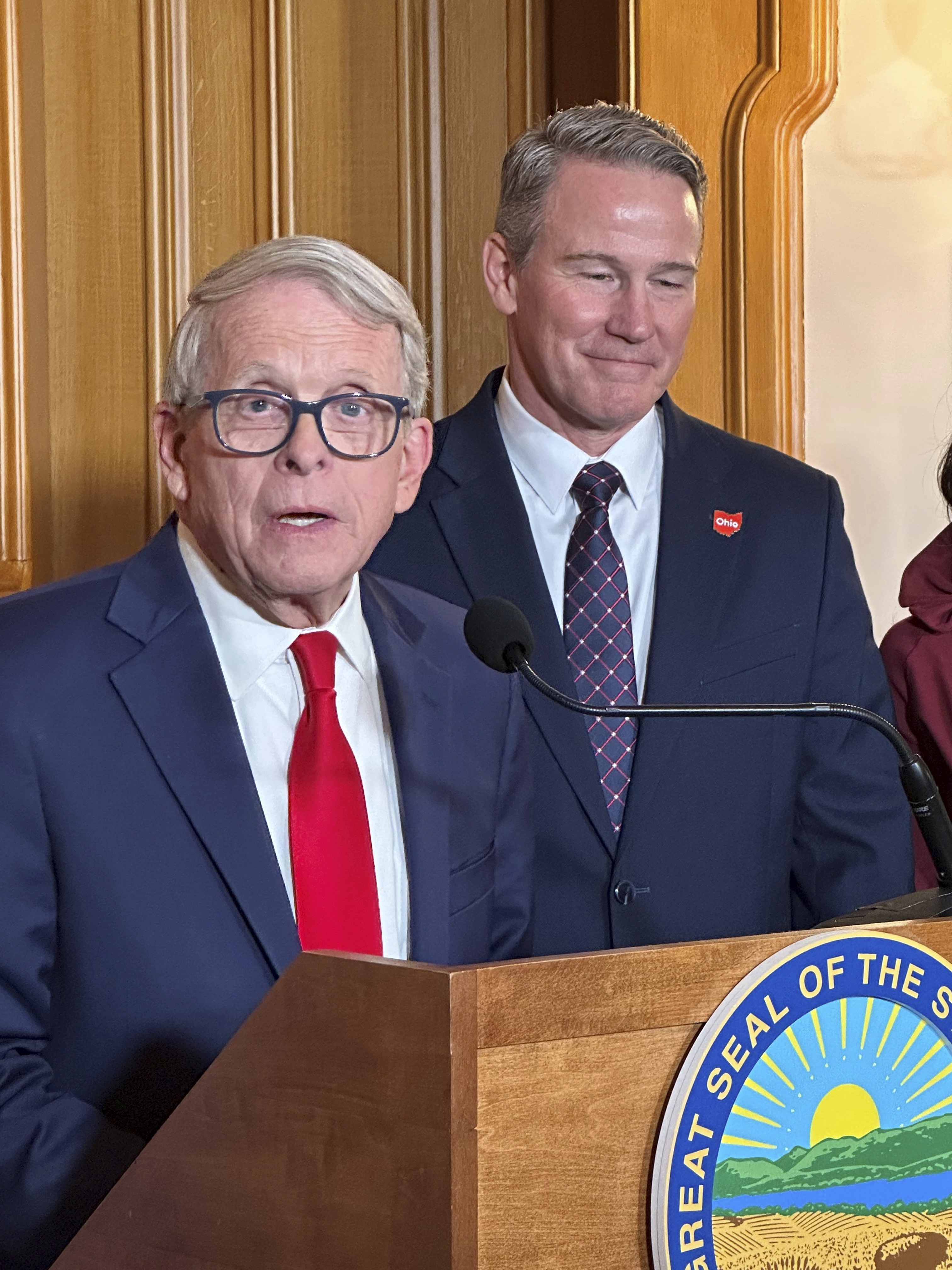 Republican Ohio Gov. Mike DeWine speaks at a news conference on Friday, Jan. 17, 2025, in Columbus, Ohio, announcing his appointment of Lt. Gov. Jon Husted, right, to fill the U.S. Senate seat formerly held by Vice President-elect JD Vance. (AP Photo/Julie Carr Smyth)