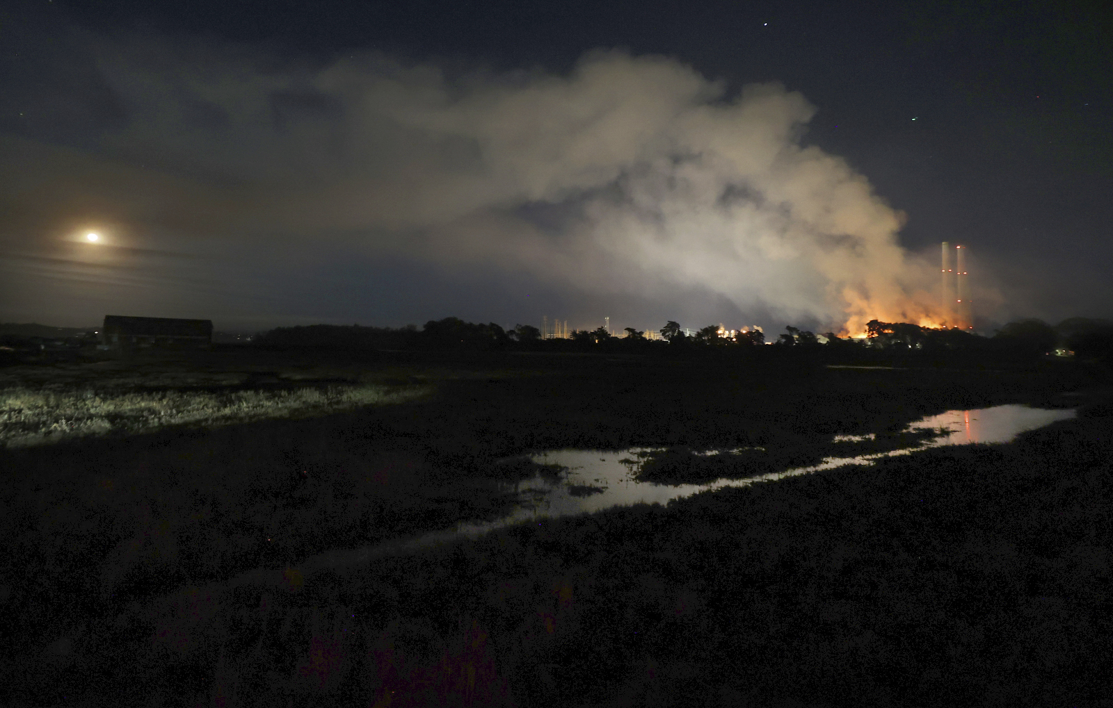 Flames and smoke from a fire fill the sky at the Moss Landing Power Plant Thursday Jan. 16, 2025 in Moss Landing, Calif. (Shmuel Thaler /The Santa Cruz Sentinel via AP)