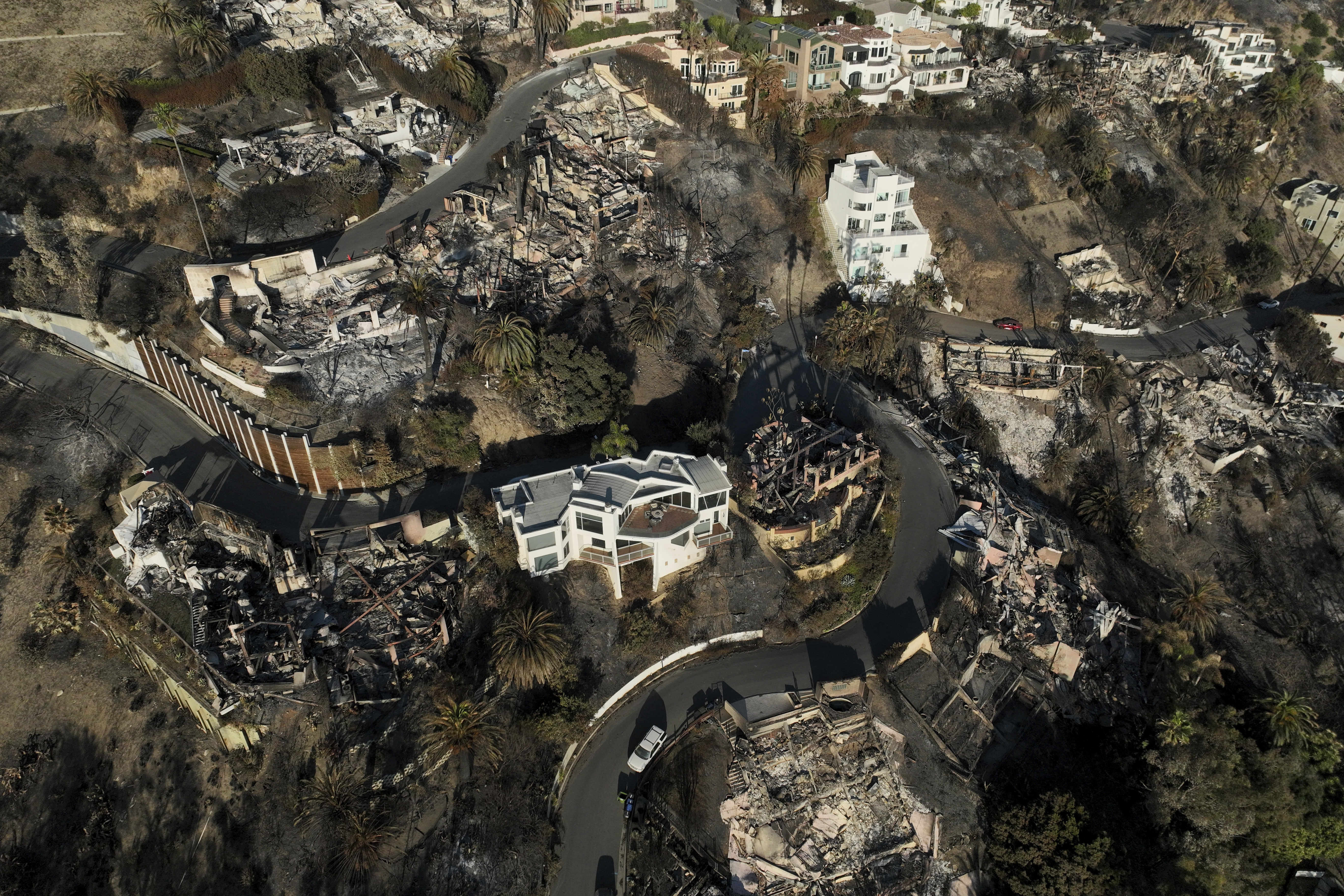 FILE - Devastation from the Palisades Fire is visible on Jan. 16, 2025, in Malibu, Calif. (AP Photo/Jae C. Hong, File)