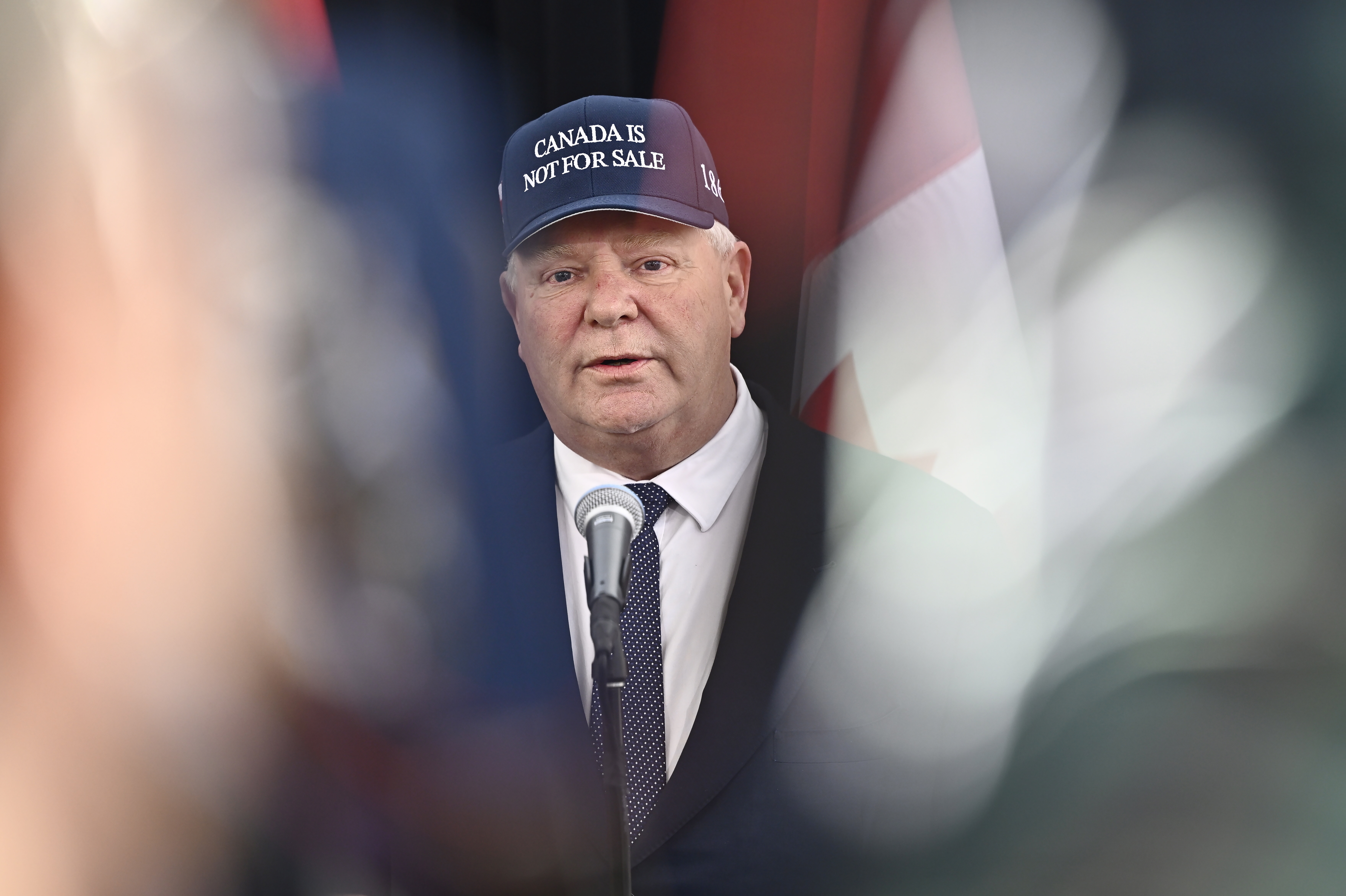 FILE - Ontario Premier Doug Ford, wearing a 'Canada Is Not For Sale' hat, speaks as he arrives for a first ministers meeting in Ottawa, Jan. 15, 2025. (Justin Tang/The Canadian Press via AP, File)