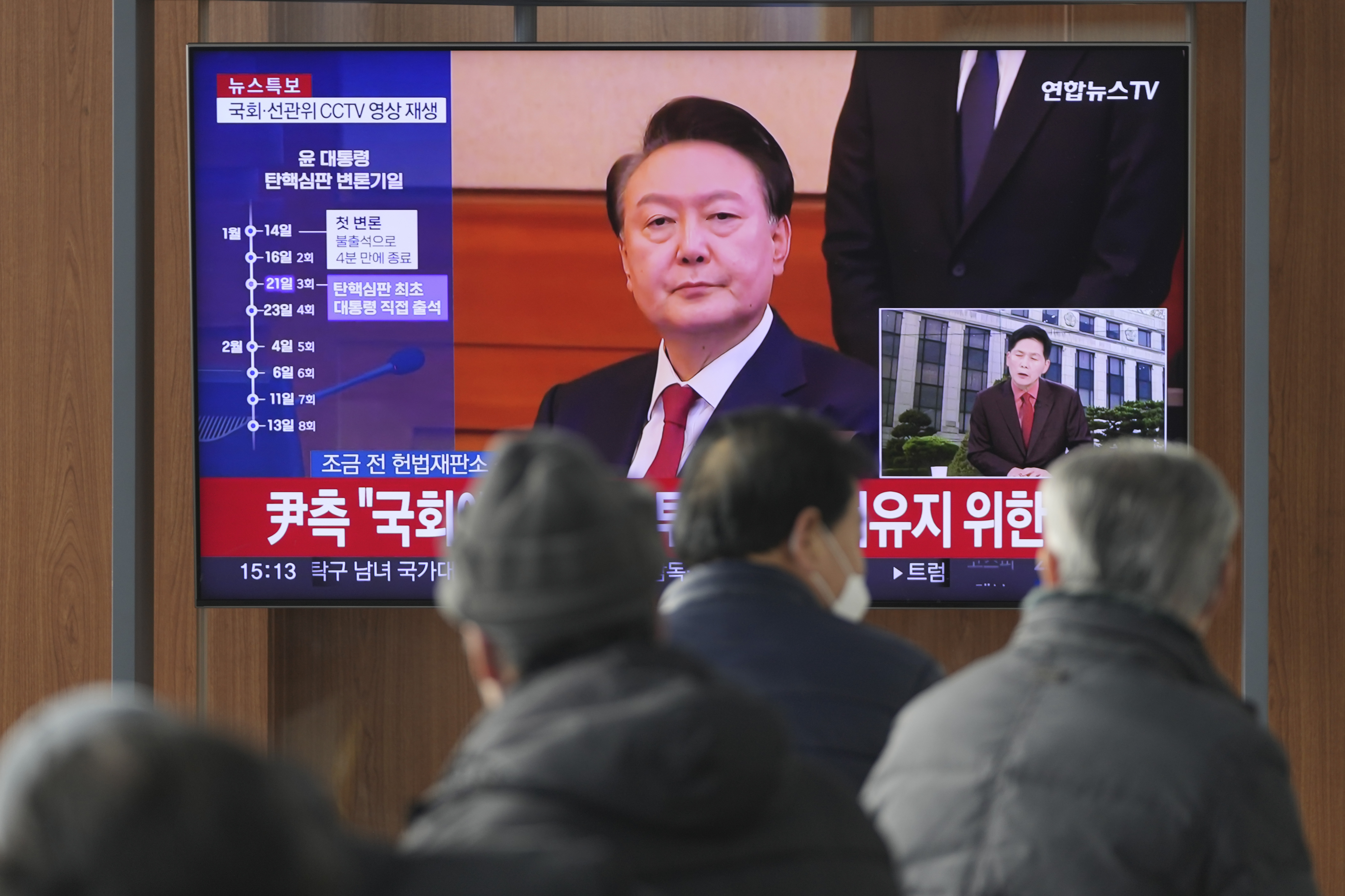 A TV screen shows footage of impeached South Korean President Yoon Suk Yeol during a news program at the Seoul Railway Station in Seoul, South Korea, Tuesday, Jan. 21, 2025. (AP Photo/Lee Jin-man)