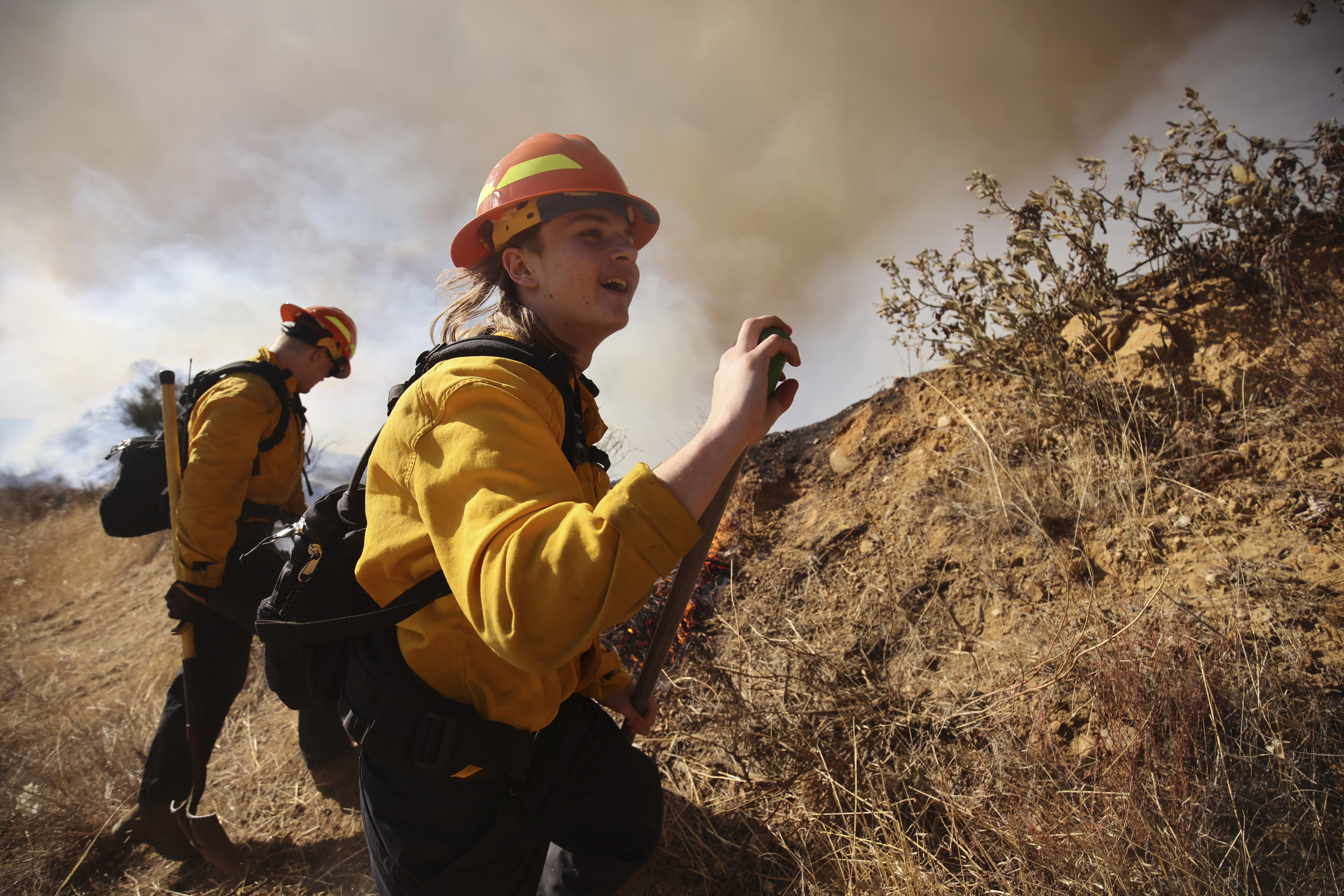 Firefighters work to control the spread of the Hughes Fire in Castaic, Calif., Wednesday, Jan. 22, 2025. (AP Photo/Ethan Swope)