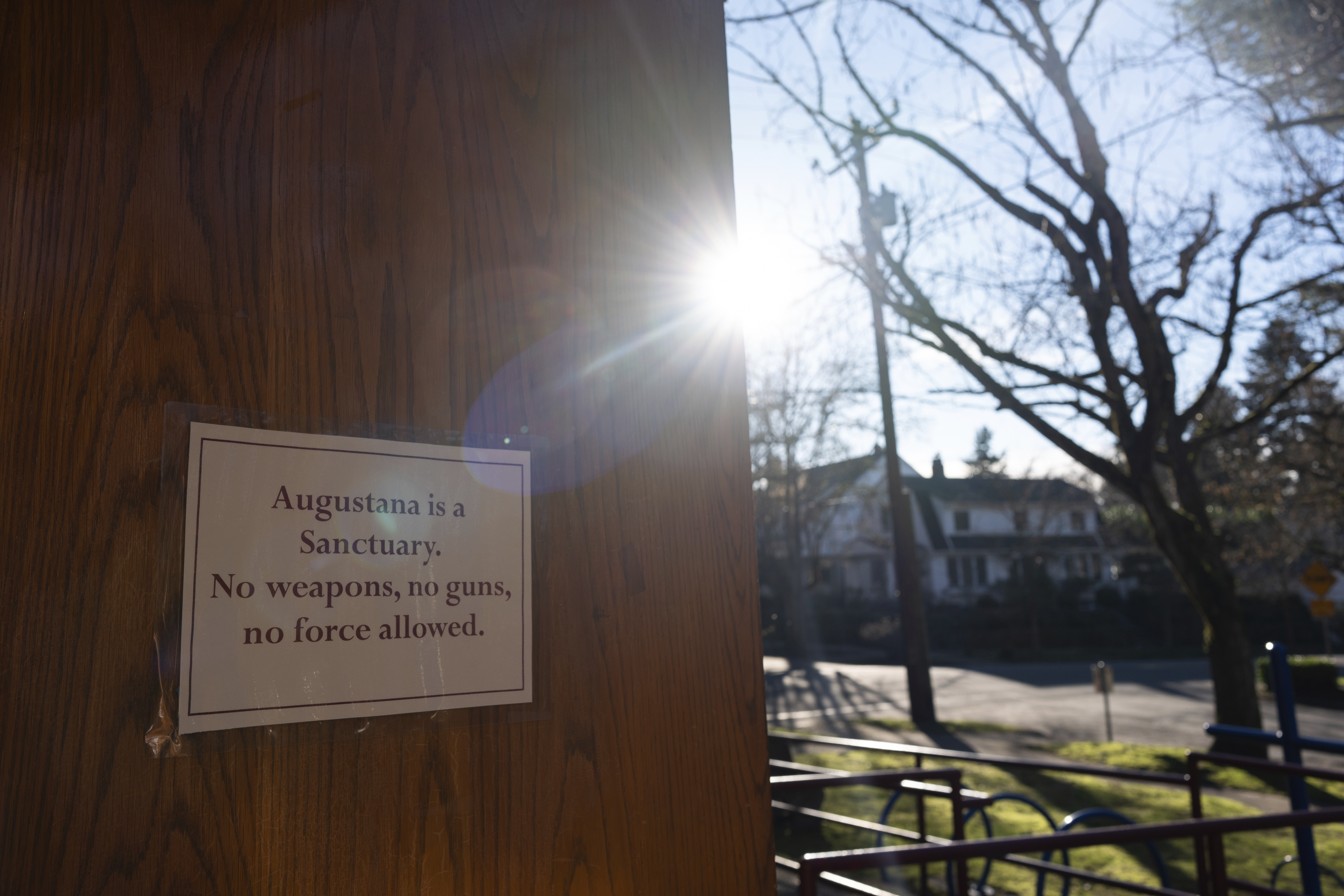 A sign reading "Augustana is a Sanctuary" is displayed on a door at the Augustana Lutheran Church, Thursday, Jan. 9, 2025, in Portland, Oregon. (AP Photo/Jenny Kane)