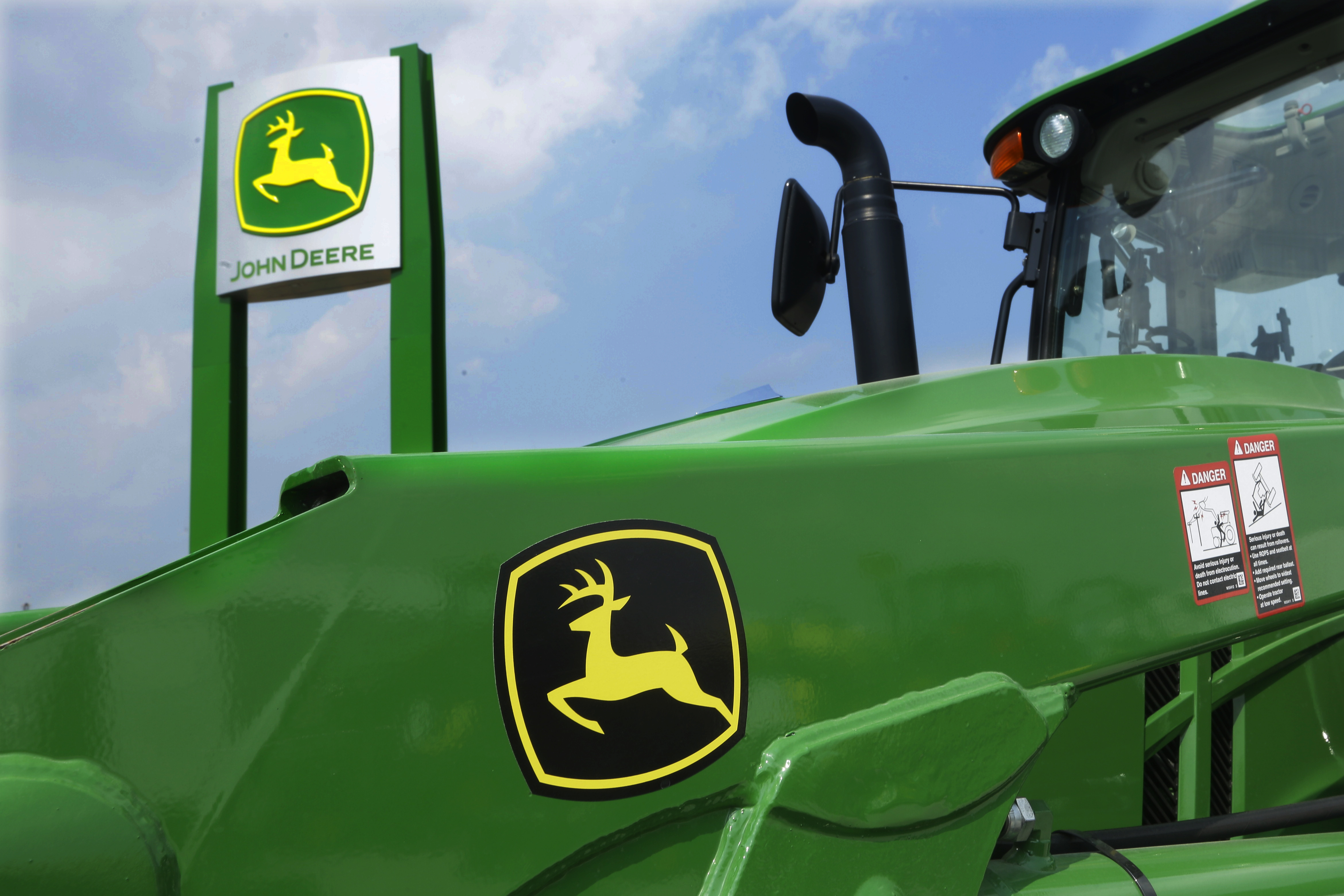 FILE - John Deere equipment is on display at the Farm Progress Show in Decatur, Ill., Aug. 31, 2015. (AP Photo/Seth Perlman, File)