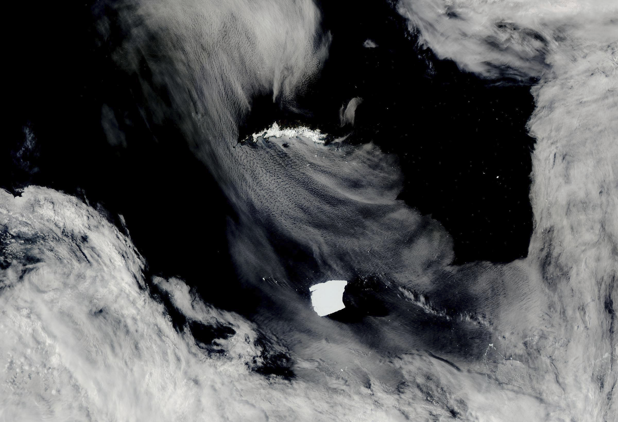 An iceberg seen on NASA’s Aqua satellite, known as A23a, center, is visible as it heads toward South Georgia Island, top, on Jan. 15, 2025, off the coast of Antarctica. (NASA Worldview via AP)