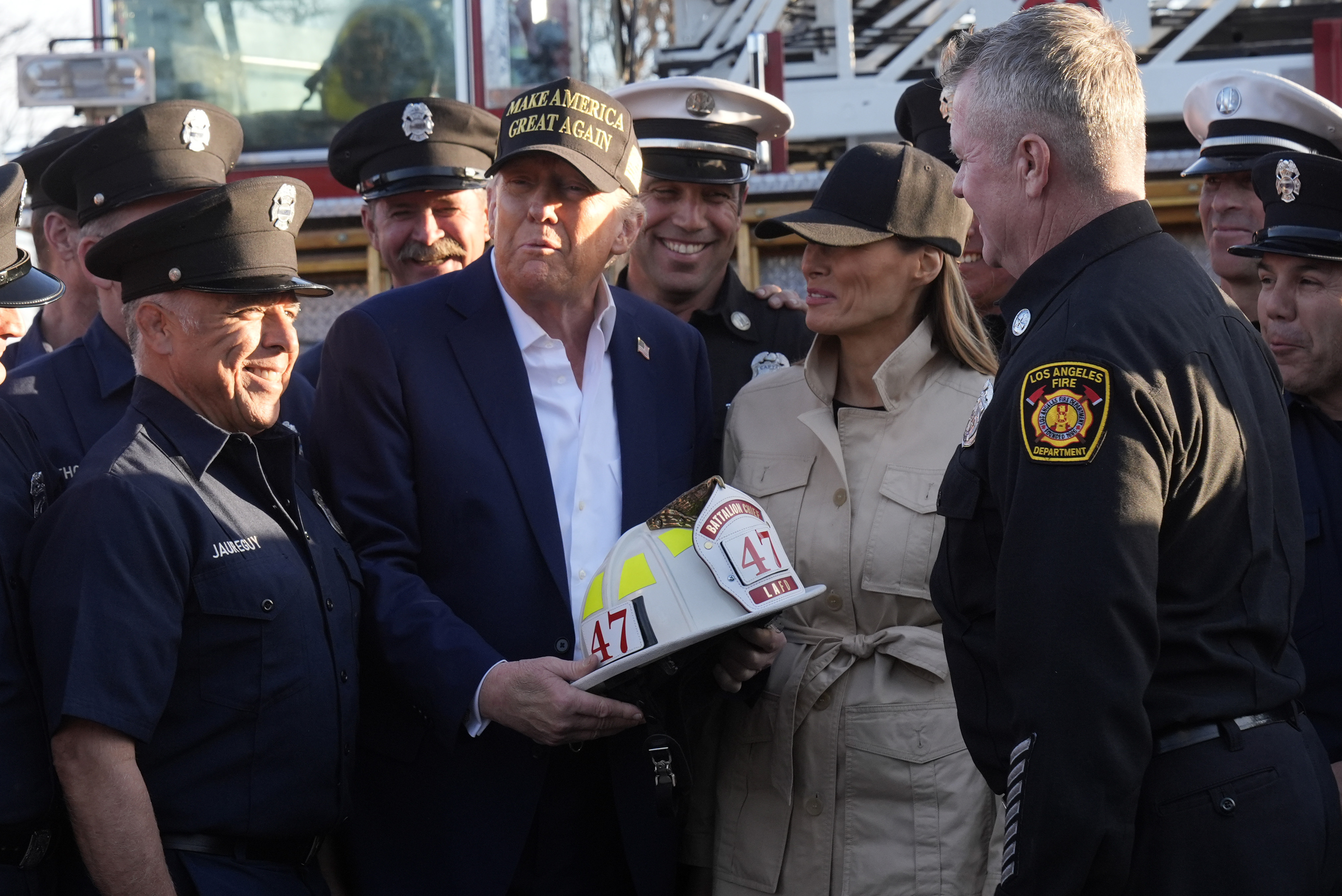 FILE - President Donald Trump and first lady Melania Trump talk with Los Angeles firefighters as they tour the Pacific Palisades neighborhood affected by recent wildfires in Los Angeles, Friday, Jan. 24, 2025. (AP Photo/Mark Schiefelbein, File)