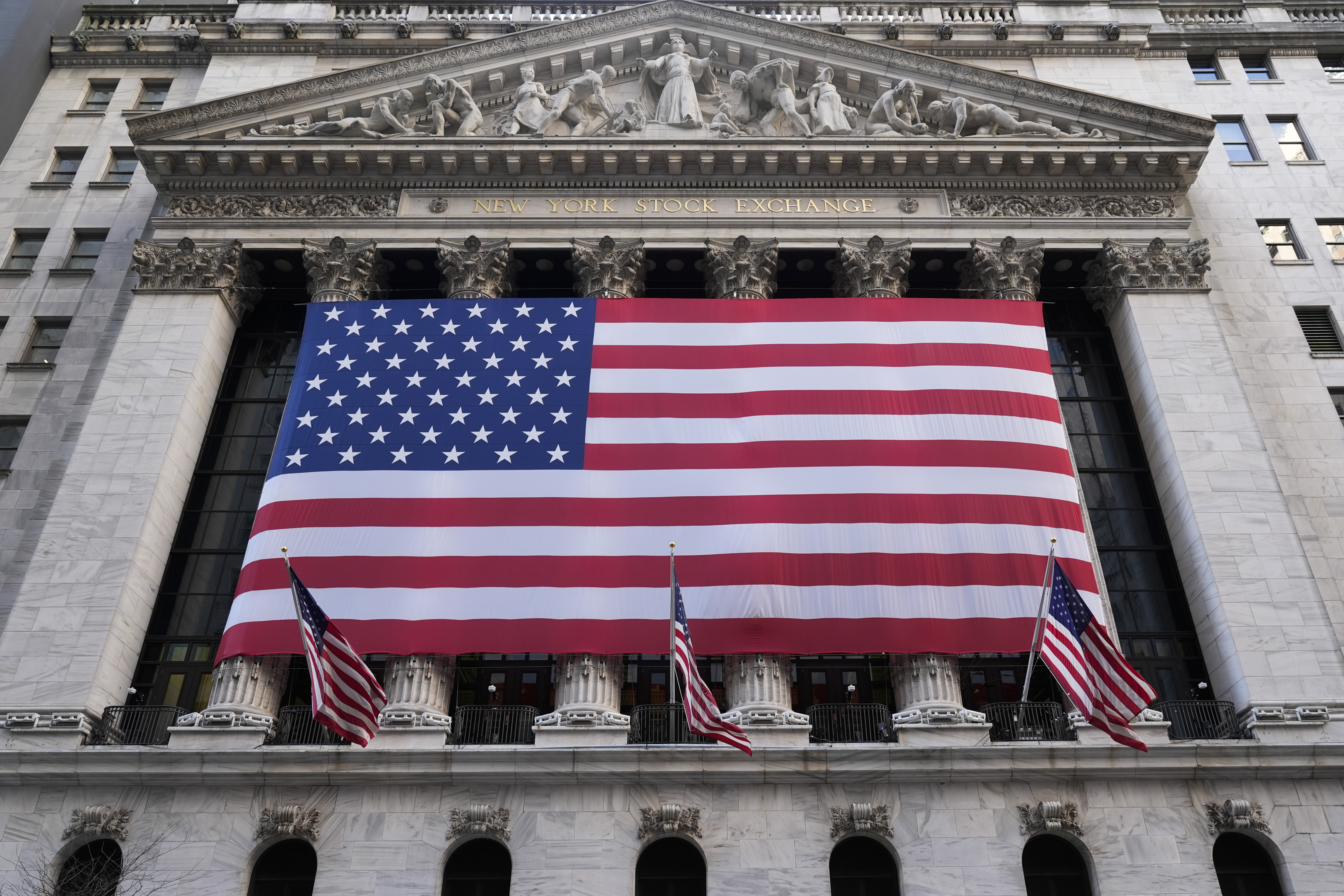 FILE - An American flag is displayed on the New York Stock Exchange in New York, Monday, Feb. 24, 2025. (AP Photo/Seth Wenig, File)