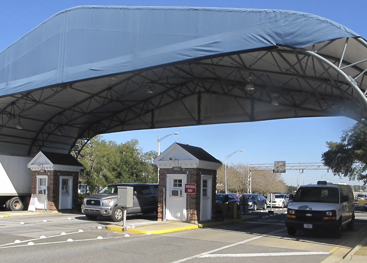 FILE- In this Jan. 29, 2016 file photo shows the entrance to the Naval Air Base Station in Pensacola, Fla. (AP Photo/Melissa Nelson, File)