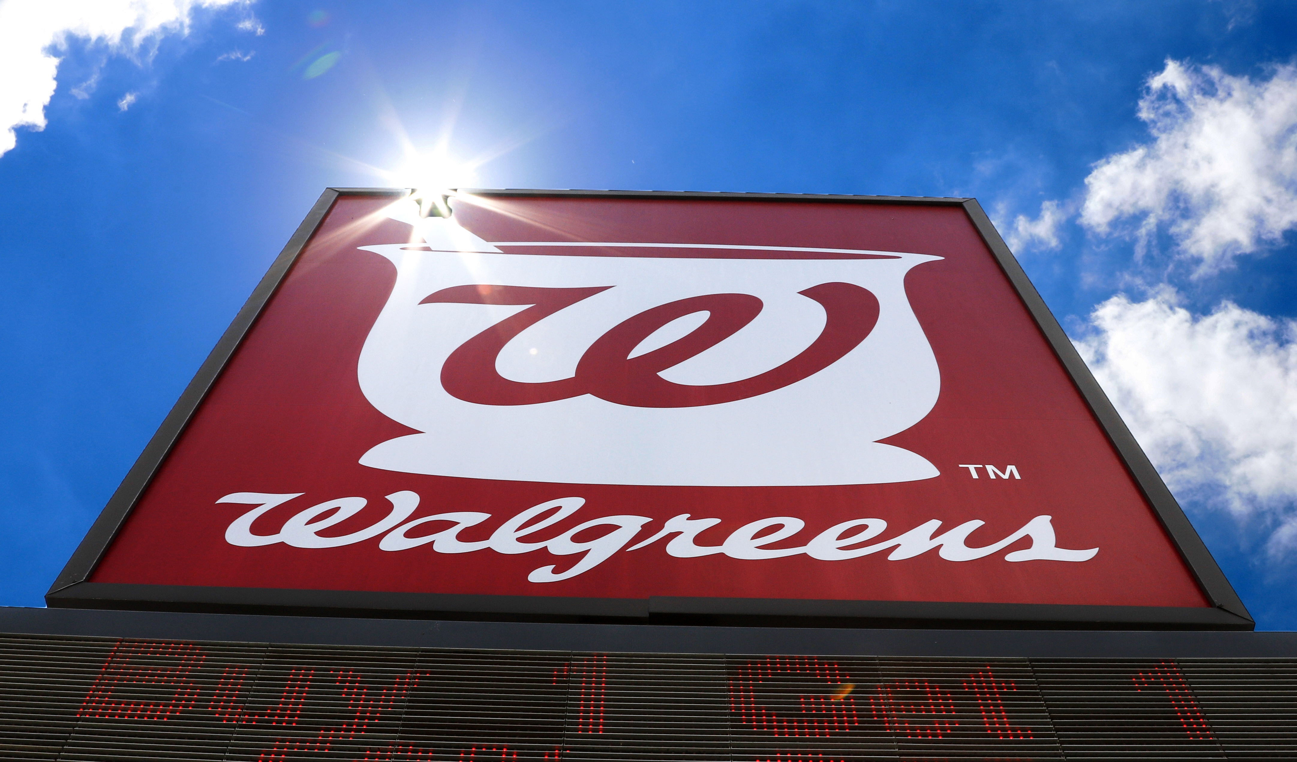 FILE - A sign for Walgreens Pharmacy is shown on June 25, 2019, in Pittsburgh. (AP Photo/Gene J. Puskar, File)