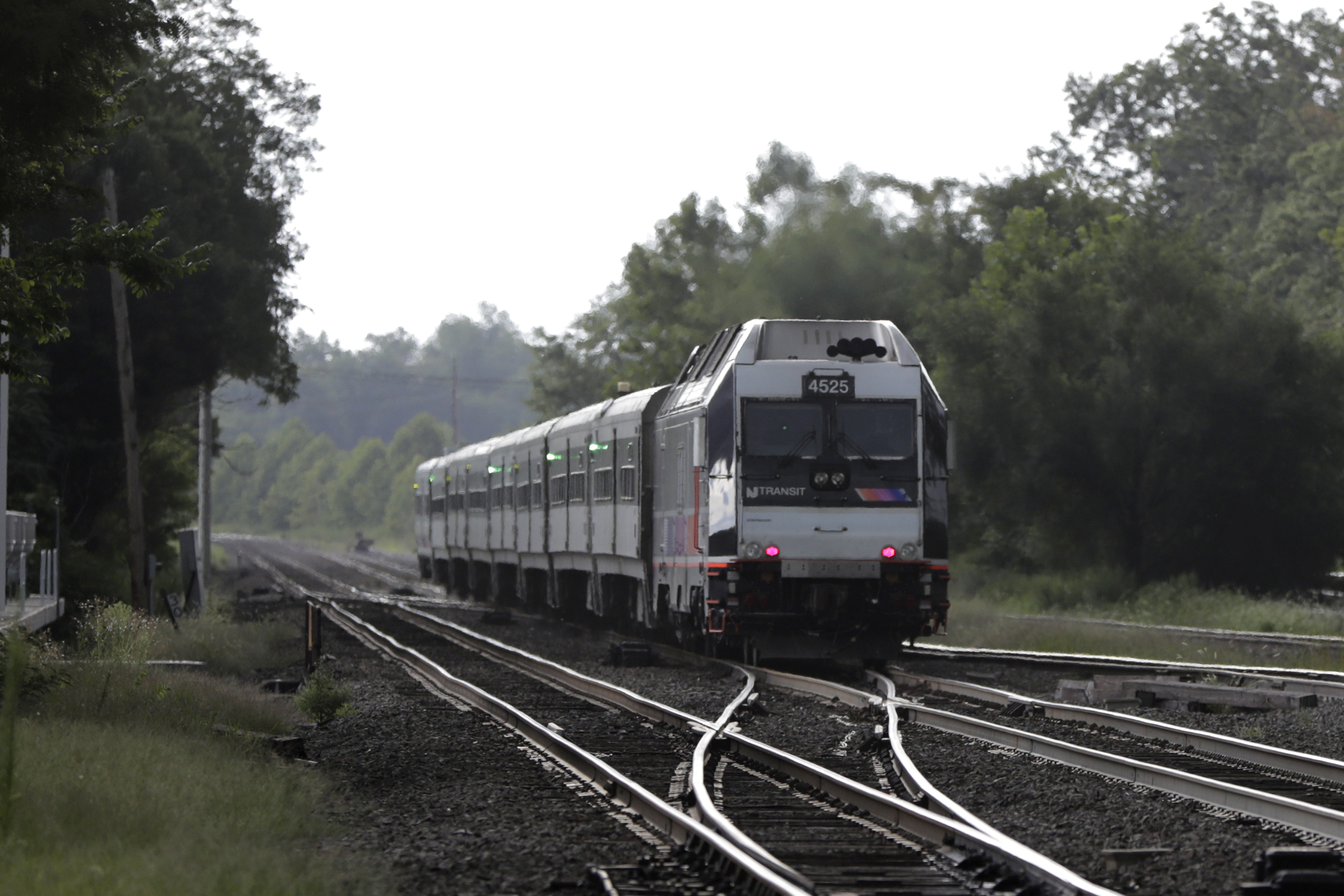 FILE - A New Jersey Transit train leaves the Bound Brook Station in Bound Brook, N.J, Aug. 3, 2018. (AP Photo/Julio Cortez, File)