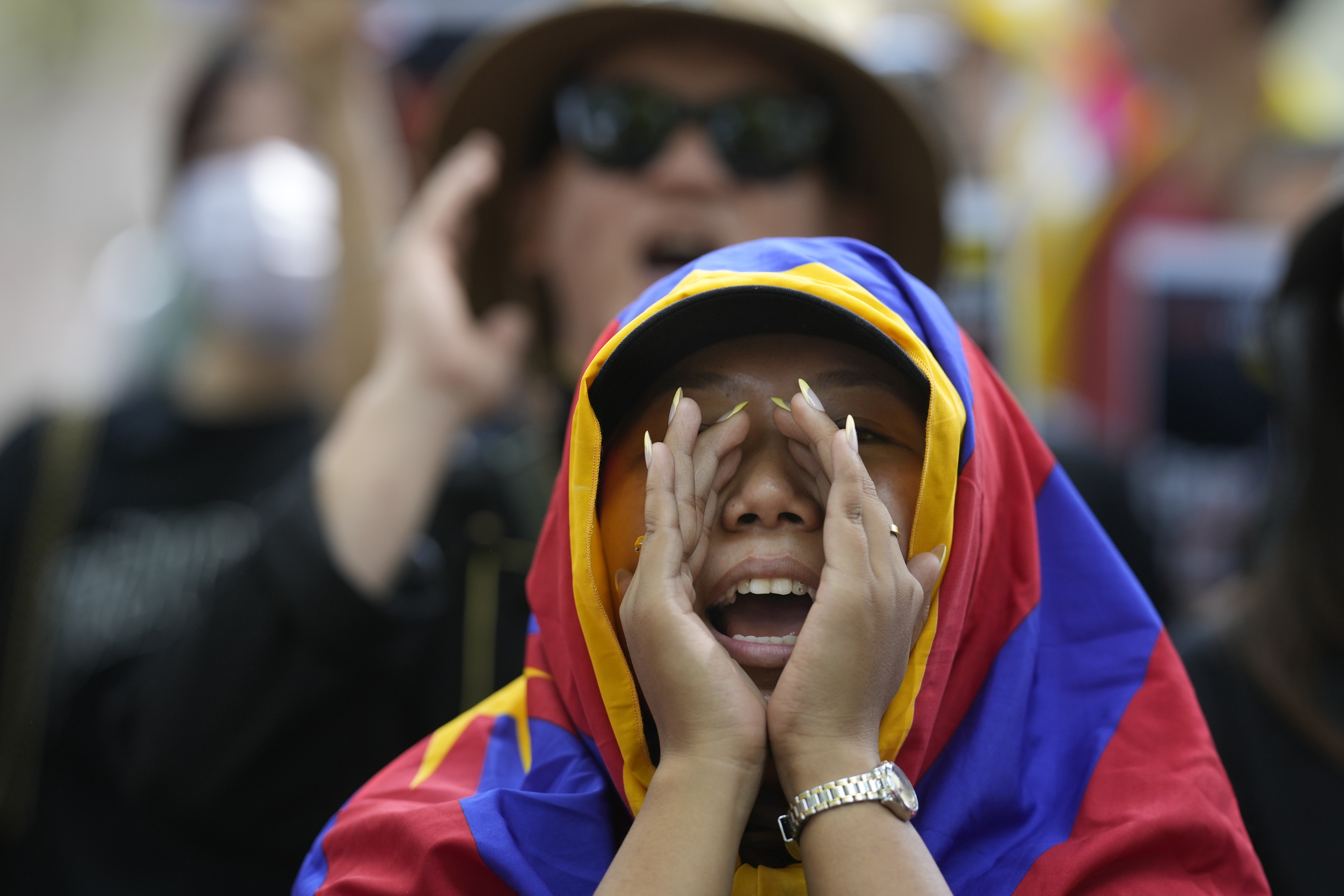 Exiled Tibetans shout slogans during a protest to commemorate the 1959 uprising in Tibet against the Chinese, in New Delhi, India, Monday, March, 10, 2025. (AP Photo/Manish Swarup)