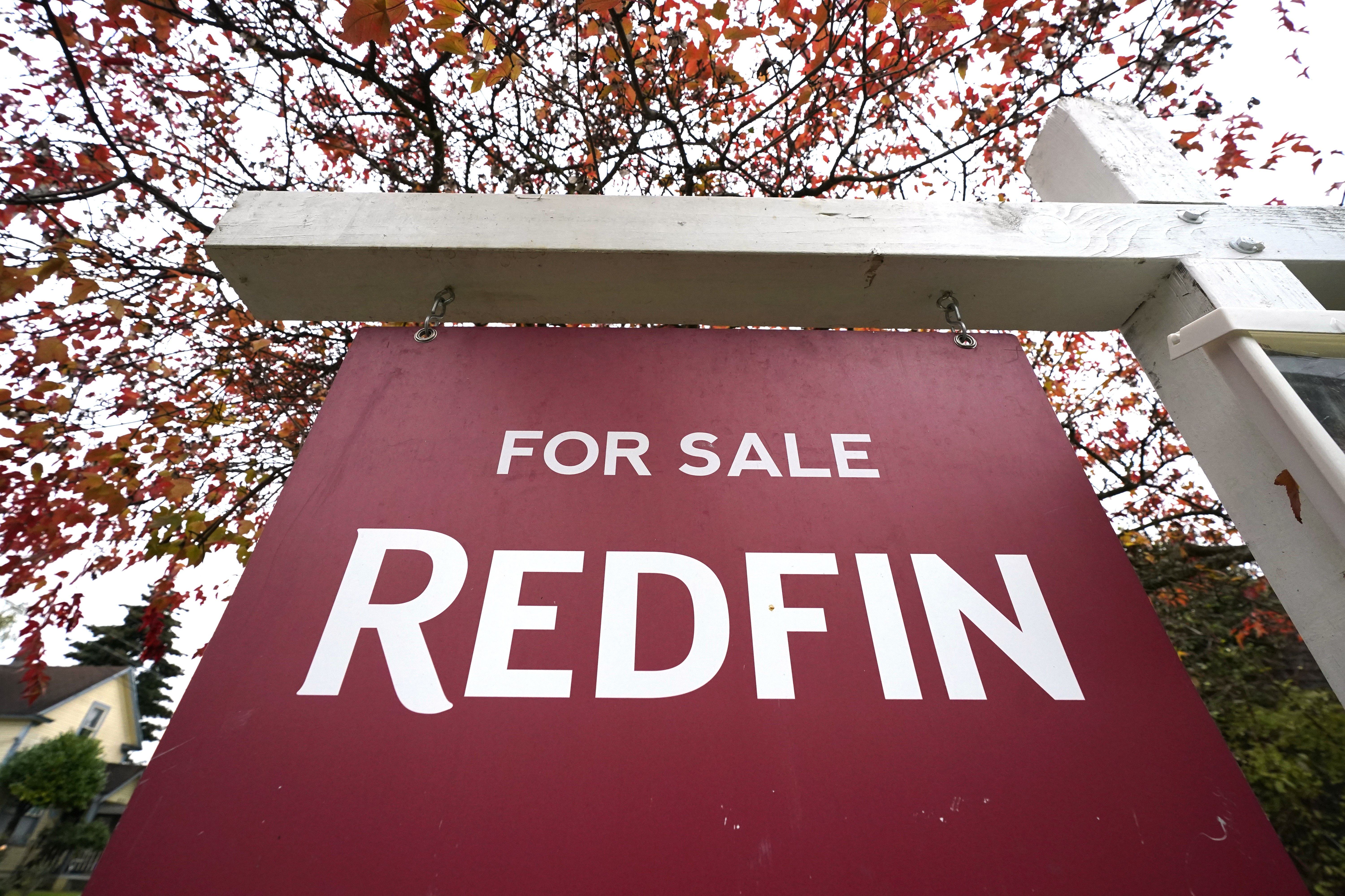 FILE - A Redfin "for sale" sign stands in front of a house on Oct. 28, 2020, in Seattle. (AP Photo/Elaine Thompson, File)