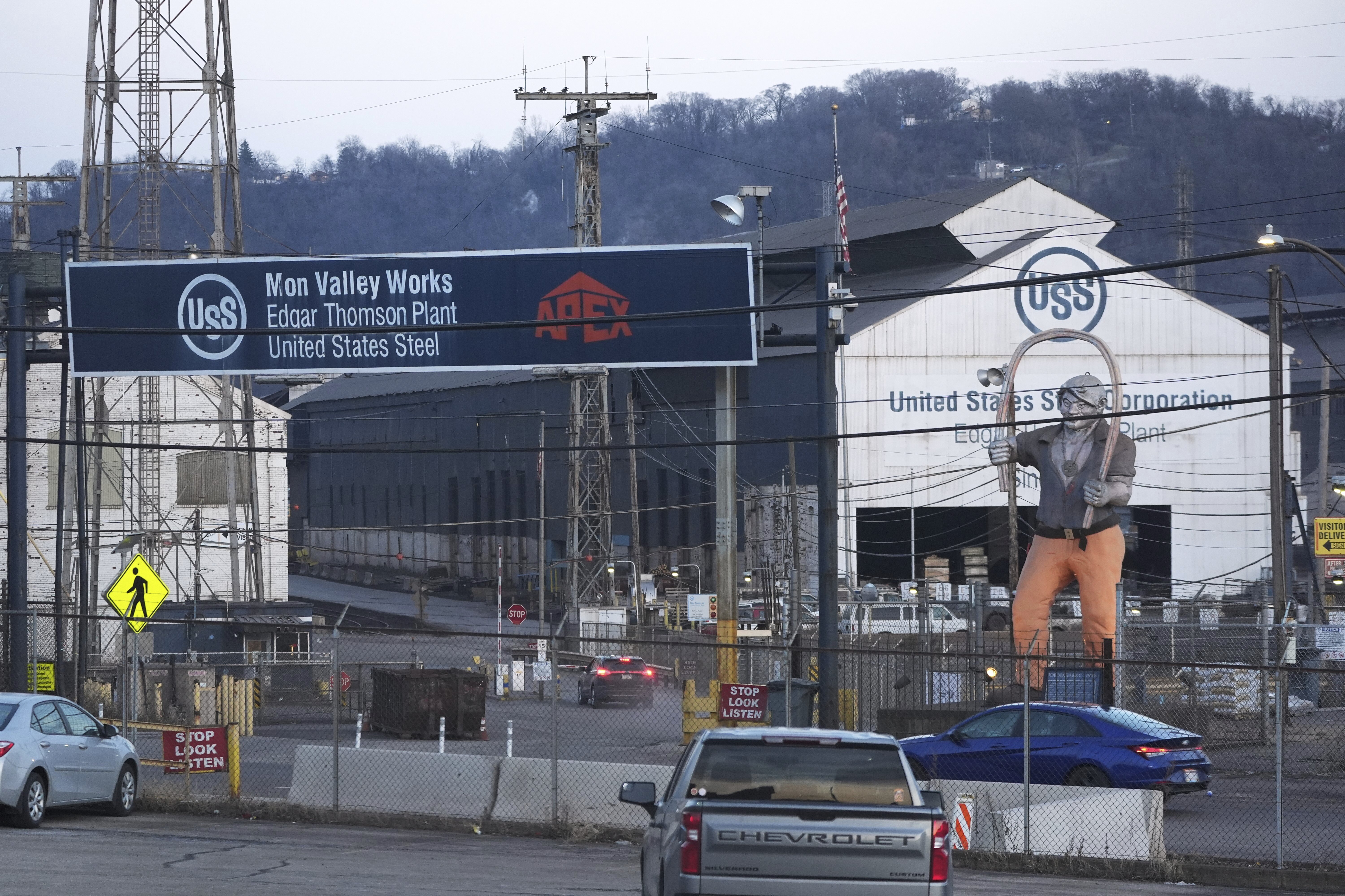 Cars sit parked outside the United States Steel Corporations Edgar Thomson Plant in Braddock, Pa., on Tuesday, March 4, 2025, in Braddock, Pa. (AP Photo/Gene J. Puskar)