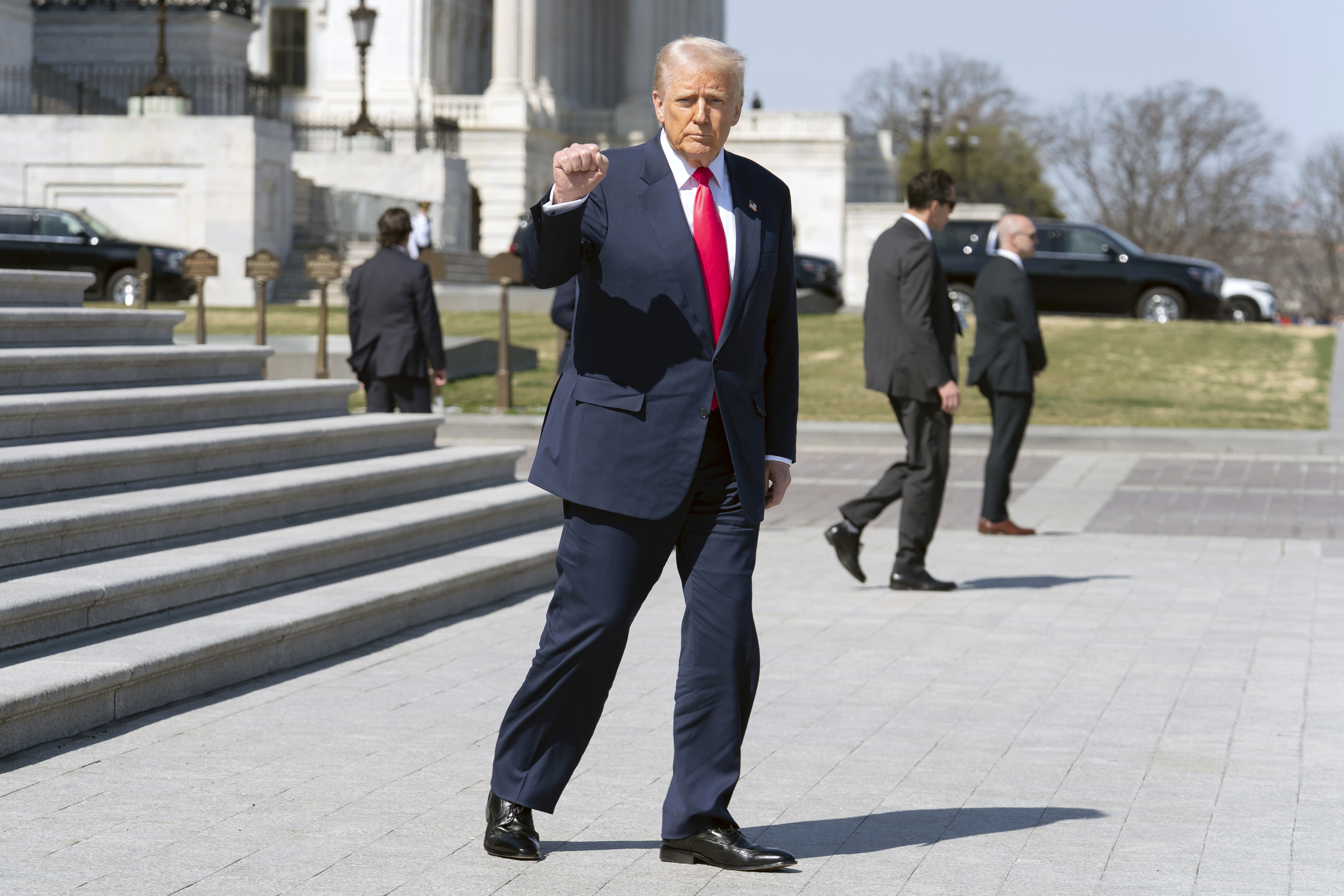 President Donald Trump gestures to the media as he leaves after a luncheon with the Speaker of the House Mike Johnson, R-La., and Ireland's Prime Minister Micheal Martin at the U.S. Capitol on Wednesday, March 12, 2025, in Washington. (AP Photo/Jose Luis Magana)