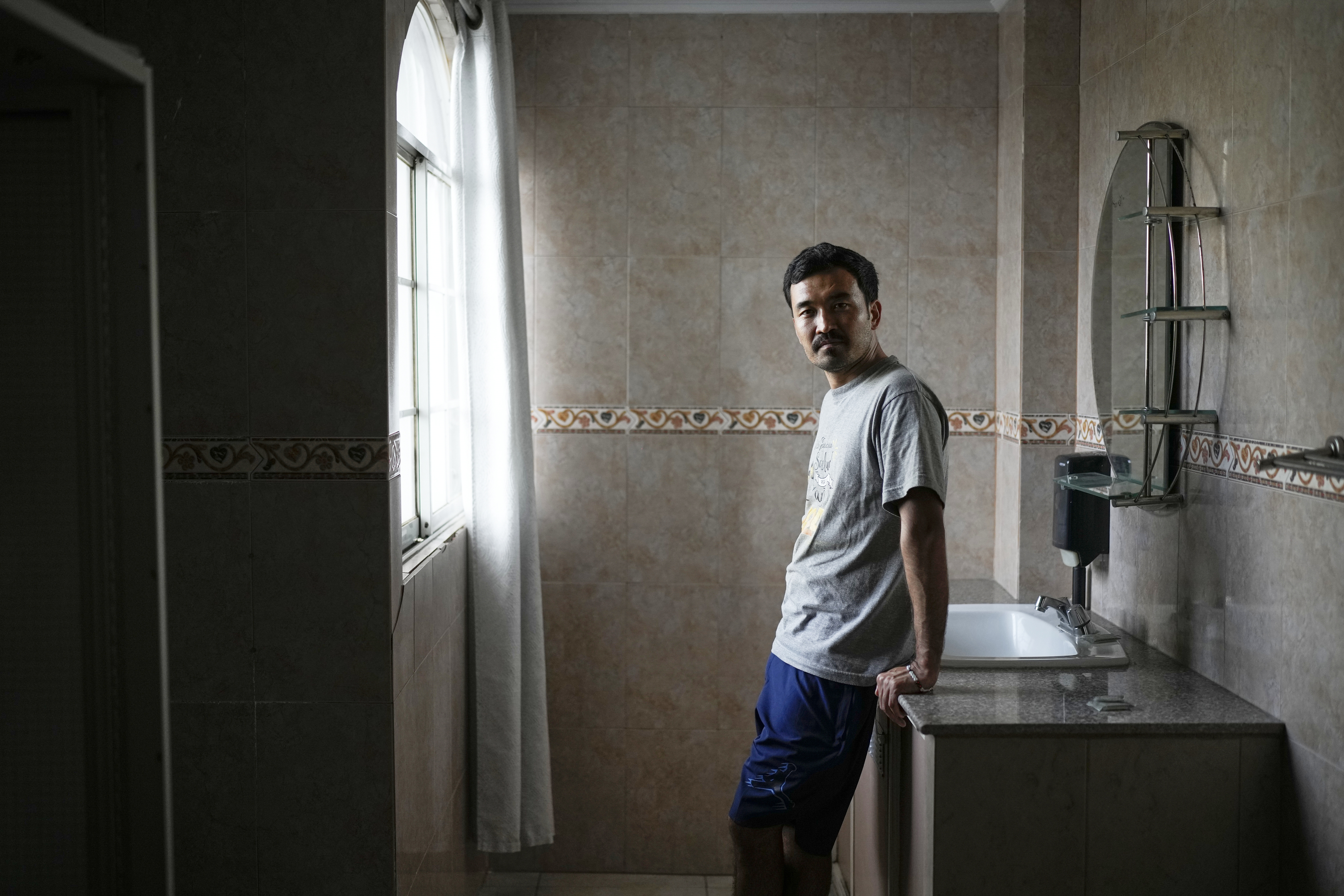 Afghan migrant Hayatullah Omagh poses for a portrait in Panama City, Monday, March 10, 2025, after being deported from the United States, detained for weeks in a Panamanian immigration camp and released on a temporary humanitarian visa allowing a 30‑day stay. (AP Photo/Matias Delacroix)